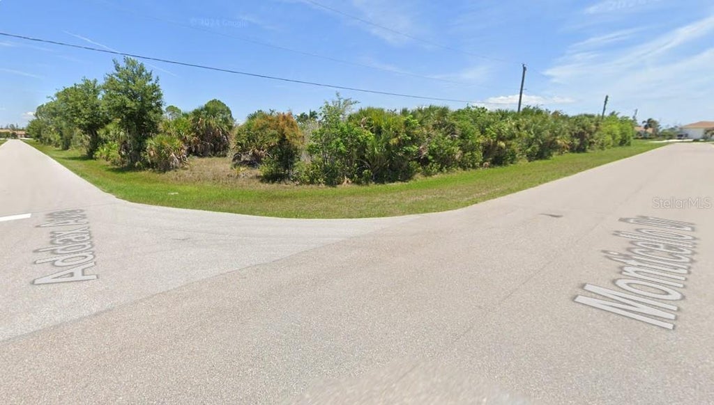 Photo of 10426 Monticello Drive, Port Charlotte, FL 33981 (MLS # C7530532)