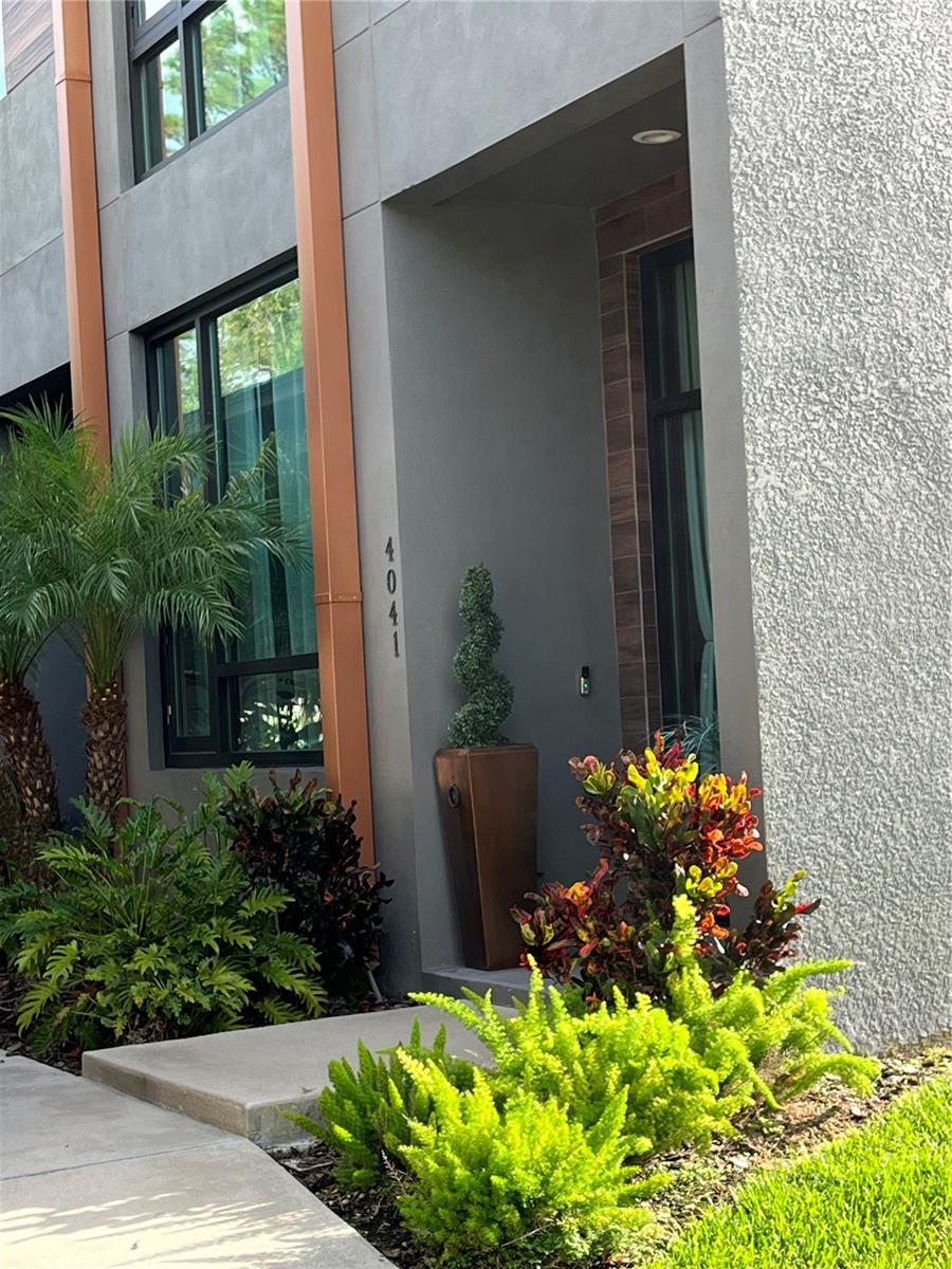 Welcome home! The unique modern architecture of this end unit in Gauge Line Lofts is sure to please. Centrally located with quick accessibility to all that Tampa Bay has to offer. The Tampa Airport, International Plaza, and Raymond James Stadium are only a short drive away. Work and play in Tampa and then come home to your contemporary/industrial townhome in Carrollwood. Enjoy the easy upkeep of the epoxy concrete floors in the main living areas. The kitchen has stainless steel appliances and granite countertops. The living room with brick feature wall has floor to ceiling glass and opens to the back patio which provides a beautiful view of the pond. There is one bedroom on the first floor and a bathroom. Climb the open steel stairway to the second floor and have a seat in the landing area that overlooks the space below. Upstairs there are two ensuite bedrooms and the laundry area. The primary suite bathroom has a double sink vanity and walk-in shower. All bedrooms have a walk-in closet and carpet. The spiral staircase on the second-floor landing leads to the private rooftop terrace. Entertain your friends/family here and shoot a game of pool while dinner is on the grill. Pool table and grill included. One year lease required. No smoking. Discounted rent of $3600 for 2yr lease. Comes with one car garage and one covered parking spot.