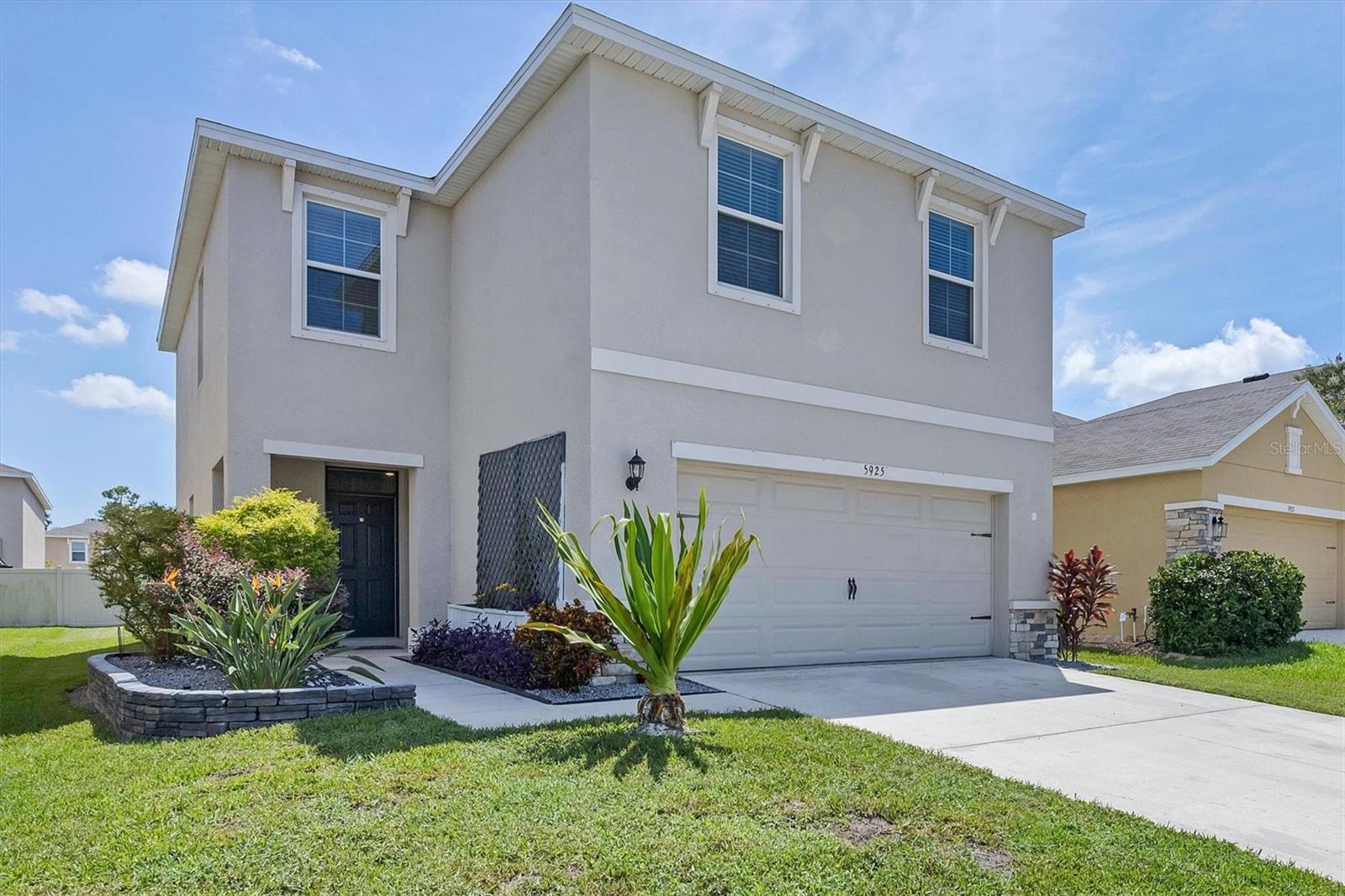 Welcome to this beautifully maintained, nearly new 4-bedroom, 2.5-bathroom home offering the perfect blend of space, style, and functionality. Built with today’s lifestyle in mind, this home features an open-concept layout ideal for both everyday living and entertaining. Step inside to a bright and airy main level with high ceilings, tile flooring, and a modern kitchen complete with stone countertops, stainless steel appliances, a large center island, and a walk-in pantry. The kitchen flows seamlessly into the dining area and spacious living room, creating a warm and inviting atmosphere. Upstairs, you’ll find four generously sized bedrooms, including a private primary suite with a walk-in closet and an en-suite bathroom featuring dual sinks and an oversized walk-in shower. A full hall bathroom and convenient upstairs laundry add to the home’s thoughtful layout. Additional highlights include a guest-friendly half bath on the main floor, a 2-car garage, energy-efficient systems, and a landscaped backyard ready for outdoor enjoyment. Located in a desirable gated neighborhood close to schools, parks, shopping, and commuter routes, this move-in ready home offers the comfort of new construction without the wait. Very low HOA fees and No Flood Zone. A must-see!