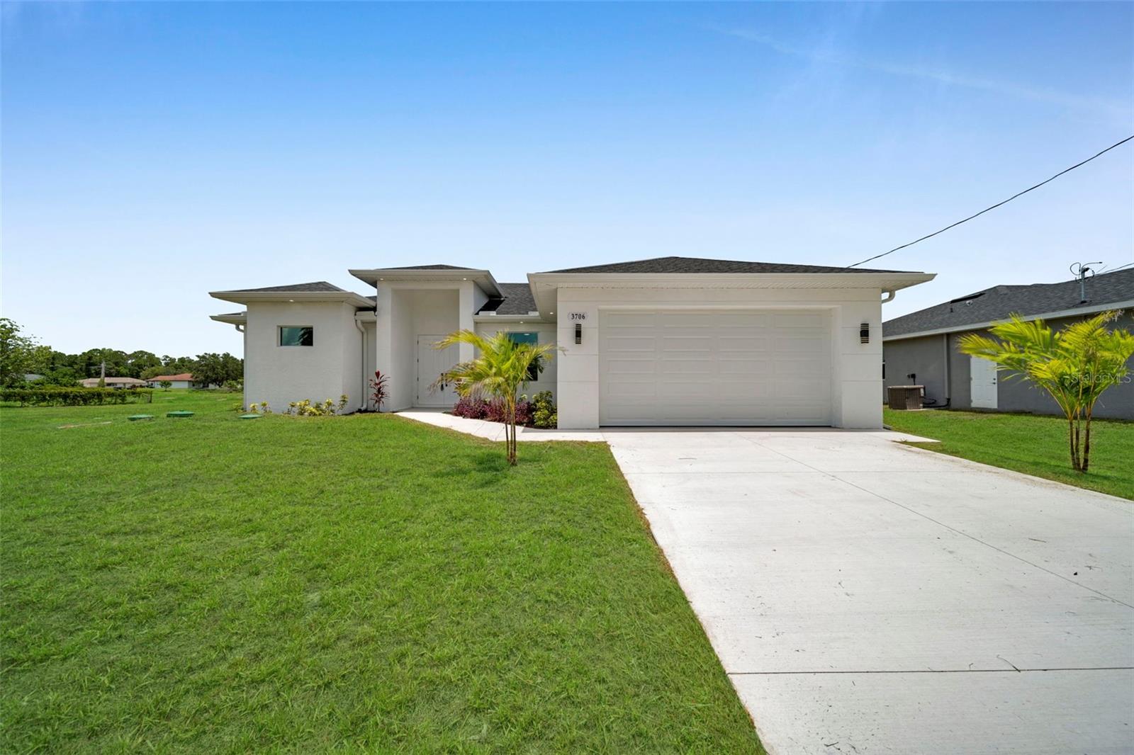 Beautifully designed 3-bedroom and a den/office home, situated in one of Lehigh Acres well-established neighborhoods. With thoughtful upgrades throughout, this home offers modern comfort and timeless style. The open-concept layout features tray ceilings in the main areas of the house, tile flooring, and unique details. The kitchen has quartz countertops, stainless steel appliances, solid wood cabinets, and a spacious pantry. The main bedroom has a walk-in closet, a main bath, and dual sinks. Built with safety and efficiency in mind, the home has hurricane-impact windows. The outdoor area features a kitchen area prepped and ready for installation, making it perfect for entertaining. Situated just minutes from shopping centers, schools, and major roads like Lee Boulevard and Sunshine Boulevard.