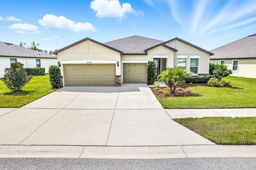 One or more photo(s) has been virtually staged. Welcome home to this stunningly elegant and immaculately maintained Centex Homes Palm Model, built in 2020 and situated on a spacious, just under ¼-acre premium pond homesite in the highly desirable community of Talavera! Boasting 2,484 square feet of living space, this 4-bedroom with a 3-car garage home features a thoughtfully designed layout and custom upgrades throughout, beginning with a grand trussed front entrance with stone elevation and glass inlay that opens to a spacious foyer with access to a flex room—ideal for a home office, den, or bonus space. The formal dining room flows effortlessly into the open-concept main living area, where the upgraded kitchen impresses with stone countertops, staggered cabinetry with crown molding, tile backsplash, pendant lighting, stainless steel appliances, an oversized eat-in island with large single basin sink, separate café area, and large walk-in pantry. Additional highlights include upgraded baseboards, neutral paint, 8-foot doorways, and tile flooring throughout the main living areas. The oversized owner’s suite offers direct pond views, dual closets, and a beautifully appointed en suite bathroom featuring a large step-in shower with upgraded shower head, dual vanities, linen closet, private water closet, and glass shower enclosure. The additional bedrooms are generously sized, positioned in a true split-floor plan for privacy near a large bathroom and extra storage closet. Bathroom 2 features its own private water room with pocket door and tub—ideal for guests or multigenerational living. A spacious interior laundry room with utility sink provides convenience with corridor access. Outdoors, enjoy a true retreat on the oversized trussed lanai overlooking one of Talavera’s largest ponds—perfect for entertaining or relaxing in privacy. Additional upgrades include an in-floor outlet in the living room, water softener, rack storage in the garage, and an additional window. Located in the resort-style community of Talavera, residents enjoy a zero-entry pool, splash pad, clubhouse, cabanas, tennis and basketball courts, playground, and weekend food trucks, with easy access to US-41, SR-52, and the Suncoast Parkway—making this exceptional home the perfect blend of size, style, lifestyle, and location. Schedule your private showing today—this one won’t last long!