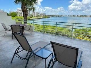 Seasonal rental available December 2025-March 2026! Updated waterfront condo in Harbourside Community available. Monthly rent is $3,950.00 and includes water, sewer, trash, basic cable, internet and electricity. This 2 bedroom, 2 bath open floor plan unit is turn-key furnished, down to the linens and dishes. Master Bedroom has cozy wood floors and an updated bathroom, shower with a tub, a walk-in closet and a wonderful waterfront view to enjoy as you awake each morning. Guest bedroom is perfect for extra space for when guests visit or to be used as an office with a desk included. Condo has an inside laundry closet with washer and dryer. Under the building parking space #85. Tenants are encouraged to leave the condo in the same condition as when they arrive to avoid a professional cleaning fee being deducted from the security deposit at the end of the lease. Security deposit will be refunded upon owners return and final review of the unit. Any lease under 6 months must add an additional 13% tax onto monthly rent. First month, last month, and security deposit due upfront. Association approval is required. No pets or smoking allowed. Owner is highly allergic to cats, so please no animals. Harbourside is a highly desirable waterfront community with multiple pools, jacuzzi, BBQ grilling area, tennis courts with pickle ball and shuffleboard. The active Club house offers a full social agenda, Men and Women Saunas, fitness centers, Billiard room, card room, library, Great room with fully equipped kitchen and a beautiful lobby to relax and visit. The car wash station is complete with vacuum and air, and a car charging station. Around the Island is a 1.5 mile trail. Harbourside is minutes from the worlds top rated beaches, Downtown St Petersburg, Museums, Theatre, Restaurants, Shopping and access to I-275.