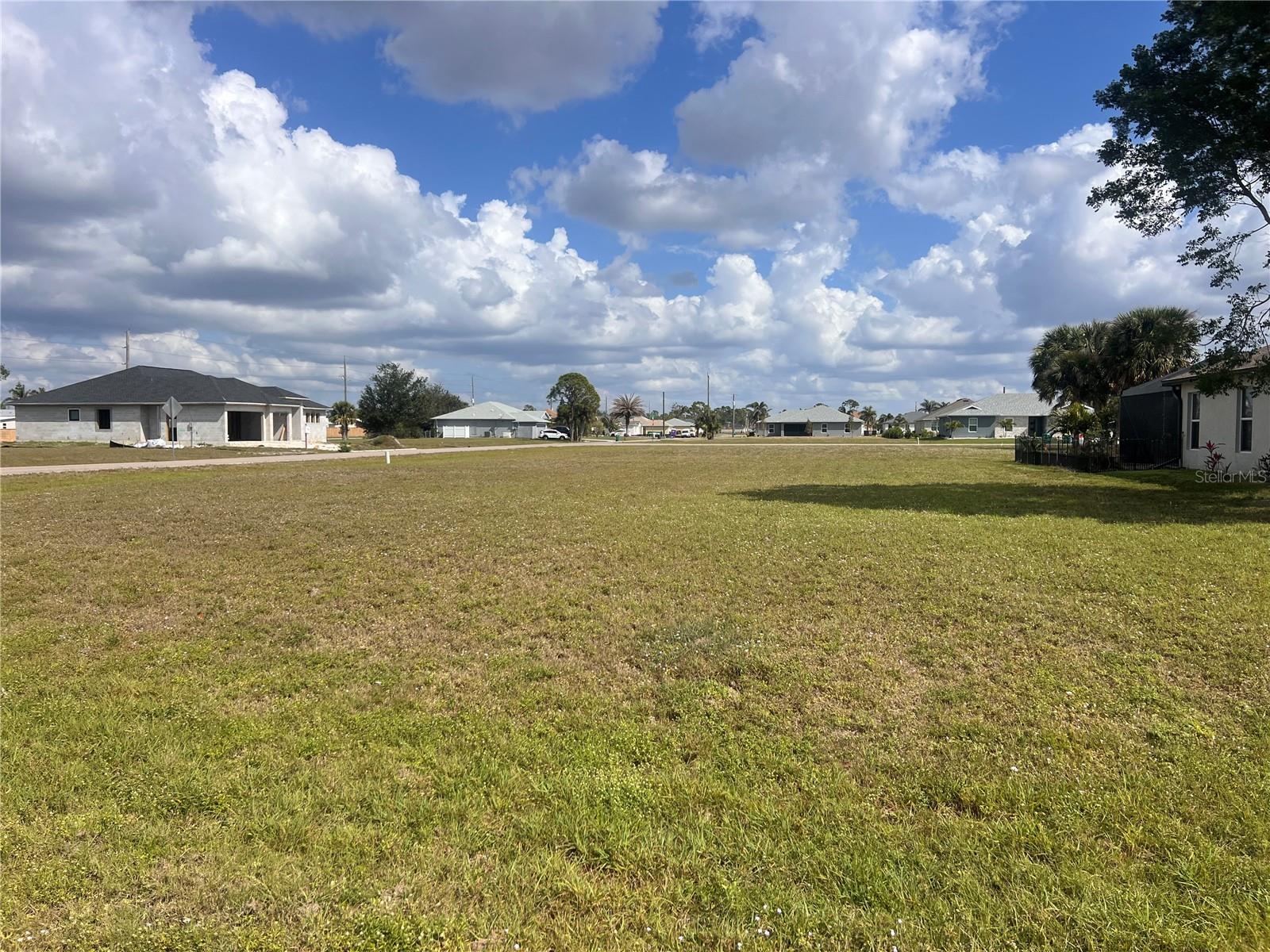 Great price for this corner lot with Western front exposure in Burnt Store Village. Land is .23 acres and dimensions are 85' x 98 x 98 x 124, cleared with NO trees with a greenbelt at rear of lot for added privacy! Build with confidence in this beautiful community and you’ll be surrounded with other newer custom homes in Punta Gorda. This quiet upscale community features City Water & Sewer, friendly Deed Restrictions, a large lake, a resident’s park with basketball court & Gazebo area, and a walking path around the lake. There is one Homeowners Association fee per year of $390. Just down the street is Burnt Store Safe Harbor Marina offering easy access to a full-service onsite marina, plus boating, golfing, dining and many other activities all close by. Street legal Golf carts are allowed throughout the surrounding communities for added convenience and fun. The Burnt Store Corridor is a short ride to Punta Gorda Airport and convenient to Fort Myers Airport only an hour away. Location is close to Lee County line for easy travel back and forth from Cape Coral or Pine Island. Downtown Punta Gorda you will find Farmers Markets, Restaurants, Shopping, Public Boat Ramps, Harbor walking trails & exercise stations, and more. So many fun things to do in Punta Gorda! Don't miss this fantastic opportunity to make this lot yours! Builder information with floorplans available. Call today!