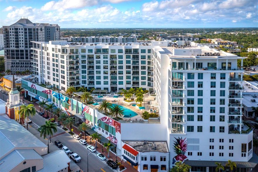 One or more photo(s) has been virtually staged.  Located in the heart of Downtown Sarasota, the Mark offers its most iconic and luxurious penthouse, providing breathtaking water views from its 12th-floor 1,450-square-foot covered wraparound terrace, complete with a summer kitchen and grill, perfect for entertaining. This stunning 3-bedroom, 3.5-bath condominium features a contemporary style, with a spectacular main living space showcasing 11-foot ceilings that offer floor-to-ceiling bay and city views. The state-of-the-art kitchen boasts elegance, equipped with JennAir appliances, Nolte European cabinetry, quartz countertops, and an entertainment island with an under-counter wine cooler. The grand owner's suite boasts a sitting area, private terrace, two walk-in closets, and a lavish spa-like dual sink bath with a spacious walk-in shower overlooking the bay. The penthouse also features two large guest suites with en-suite baths for added privacy, and a tucked-away den perfectly equipped for a media room or home office. The unit includes 2 deeded parking spots with an EV outlet, plus a 12th-floor storage unit. Residents of the Mark enjoy exclusive amenities such as a modern fitness center, 24-hour access-controlled lobby with concierge services, and a resort-style infinity lap pool with private cabanas and fire pit lounge. The Residents’ Club Room features a catering kitchen and club bar for special events. With downstairs access to all that Sarasota’s downtown living has to offer, this prime location is perfect for the discerning buyer.