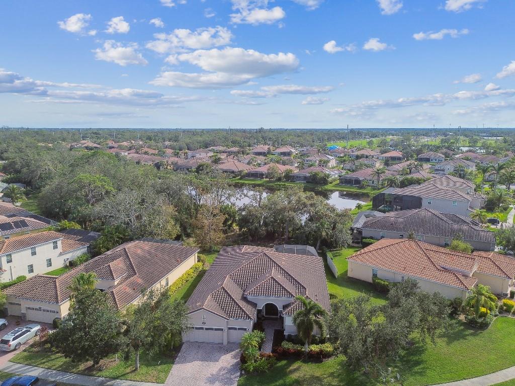 ***Motivated Seller*** Make an offer today! This exceptional family home, nestled in the highly desirable gated community of Red Hawk Reserve, offers the perfect blend of privacy and convenience. Set on a premium nature preserve lot, this expansive 4-bedroom, 3-bathroom home boasts over 3,400 sq. ft. of living space! As you step through the stunning, upgraded front doors with designer glass, you\'re welcomed into a bright and open living environment. The open floor plan, soaring 12 ft. ceilings in both the living room and master bedroom, and 8\' doors create an inviting atmosphere, enhanced by 20\" porcelain tile throughout. The home features a range of luxurious upgrades, including crown molding in every room, refined light fixtures, ceiling fans, custom window treatments, Corian windowsills, and custom closet systems in nearly every room to maximize storage. The modern, gourmet kitchen is a chef’s dream, equipped with sleek stainless steel appliances, granite countertops, and upgraded cabinets. Recently refinished cabinets throughout the kitchen, bathrooms, laundry room, and bar area reflect a contemporary style Perfect for entertaining, the spacious living room opens to the lanai and sparkling swimming pool via sliding doors. The pool, equipped with an electric heater, ensures year-round enjoyment! Spend your afternoons lounging by the pool or exploring the spacious backyard that overlooks the tranquil nature preserve—ideal for outdoor activities. The primary suite offers a peaceful retreat with a 12 ft. dual tray ceiling, access to the covered lanai, and two walk-in closets. The en-suite bath features dual vanities, a garden tub, and a spacious walk-in shower. Secondary bedrooms are generously sized and include a Jack and Jill bath. Additionally, the home offers a 4th bedroom/guest suite, an office/den that could easily be converted to another bedroom, and a formal dining room that could become the ultimate gaming space. Upgrades include engineered hardwood floors in all bedrooms (2020), fresh interior paint (2023), and a new A/C unit (2024). Safety features like smoke detectors, a pool child gate, and upgraded hurricane shutters give peace of mind. Located just minutes from I-75 and within one of Sarasota’s top-rated school districts, this home is also close to dining, shopping, hospitals, parks, golf courses, and the world-renowned Siesta Key Beach. Red Hawk Reserve offers the ideal location with quick access to amenities and easy proximity to the highway. Don\'t miss out on the chance to experience this amazing home in the perfect location—where luxury meets convenience, and Florida living shines at its best!