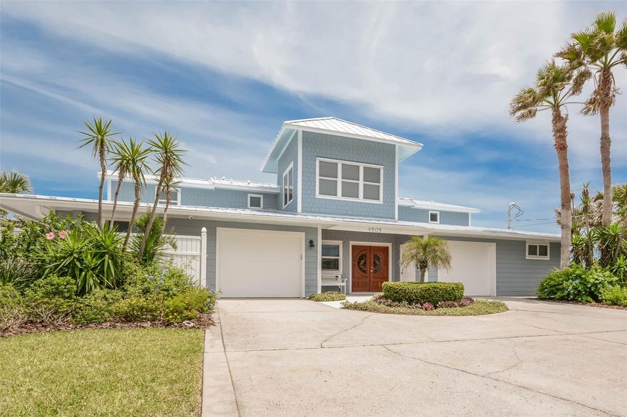 Indulge in spectacular views from this direct oceanfront, two-family, split-plan type residence. Enjoy 8 bedrooms and 7 full bathrooms. Located on the best street in New Smyrna Beach allowing for 80 ft of ocean frontage. Designer decorated and finished. Two oversized garages. Completed 20 ft. solid poured, concrete sea wall that extends north and south past both immediate neighbors, with beach access staircase. Large ocean front pool. Furnishings available. Exterior: Aluminum Roof “commercial grade”, standing seam, metal roof was replaced two years ago and carries an 18-year warranty; Hardi siding throughout installed in 2002, Balcony decking, gutter system. Windows with storm coverings included. Take pleasure in the driveway, walkways, landscaping, and irrigation along with fencing.  New septice in 2002.  Oceanfront pool with new pool pump and motor. Hand-carved entry doors, oversized oceanfront balcony and patio. Interior includes complete home renovation such as new electrical wiring, new electric fixtures, all new plumbing system, new septic system, new plumbing fixtures and oversized water heaters. All three HVAC systems have been replaced within the past five years. All mechanical systems (plumbing, HVAC, electrical, irrigation) were completely replaced during the complete renovated/overhaul in 2002.  Flooring throughout: bamboo wood, ceramic tile, & carpet.  All appliances included.  Custom wood ceilings. Integrated sound system. Cat 5 wiring throughout. Custom artist-painted walls throughout. Generous storage throughout. Most of home is poured concrete, except for a couple of 2nd floor walls (two ocean front master suites) and then covered with hardi board siding.  Tinted windows. Volume ceilings. Security system. Window coverings throughout. Artisan entry staircase. https://www.youtube.com/watch?v=lSqvP4YoBSY ;Water: City