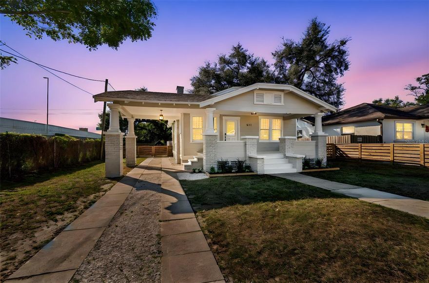 Welcome to this beautifully renovated 3-bedroom, 2-bath bungalow located in the heart of historic Tampa Heights. Thoughtfully updated from top to bottom, this move-in-ready home blends classic character with modern finishes throughout. Inside, you’ll find new flooring, fresh interior paint, updated lighting, and a completely redesigned kitchen and bathrooms. The open-concept living and kitchen area is ideal for entertaining and features a charming fireplace, a spacious island, stainless steel appliances, a range hood, and stylish finishes that flow seamlessly into the main living space. Both bathrooms have been fully renovated with glass shower/tub combinations, new vanities, updated lighting, and tile flooring. The home sits on an ample lot with a nicely sized front yard and a fenced backyard, offering plenty of space for outdoor enjoyment. Curb appeal shines with the home’s picturesque bungalow design, welcoming front porch, and open carport. While the bedrooms feature smaller closets consistent with classic bungalow architecture, the home offers exceptional living and entertaining spaces throughout. Located just minutes from Downtown Tampa, the Riverwalk, and a wide array of shopping and dining options, this home is perfectly suited for an active lifestyle while enjoying the charm of one of Tampa’s most sought-after historic neighborhoods.