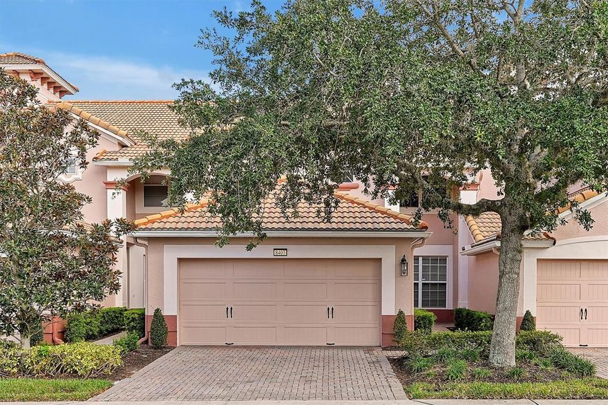 Welcome to Mandalay at Bella Trae a Del Webb gated Community.  Built around impeccable landscaping and water features Bella Trae is truly a family friendly Community offering outstanding amenities, activities and excellent management.  Amenities include state of the art clubhouse with extensive fitness center, yoga room, library, billiard room and meeting rooms.  The pool and spa are spacious with a variety of seating options and outdoor kitchen for grilling.  The tennis court, pickleball courts, putting green and bocce ball court ensure there are activities for the entire family.  Conveniently located in Champions Gate, Bella Trae is walking distance to restaurants, shops, drug store and groceries.  The 3 bedroom 2.5 bath townhome is very well located close to the Clubhouse and enjoys water feature and fountain views.  Open concept floor plan with living, dining, eat in, kitchen, powder room and laundry conveniently located on the ground floor.  A full wall of sliding doors to the spacious lanai ensure adequate space for outdoor living.  The attached 2 car garage conveniently opens into the laundry room.  Upstairs features a spacious master suite with large bath featuring tub, shower, dual sinks and spacious walk in closet.  Two additional bedrooms and guest bath round out the upstairs and provide privacy.  Bella Trae is truly an oasis of serenity for the whole family.  Highly rated Charter schools with 3 miles of Community.  Regularly planned organized activities including, dinners, games nights, book club, golf scrambles, food trucks, coffee bar and ensure there is always something to do.  Come join us in a truly wonderful Community and spacious living in your own townhome.