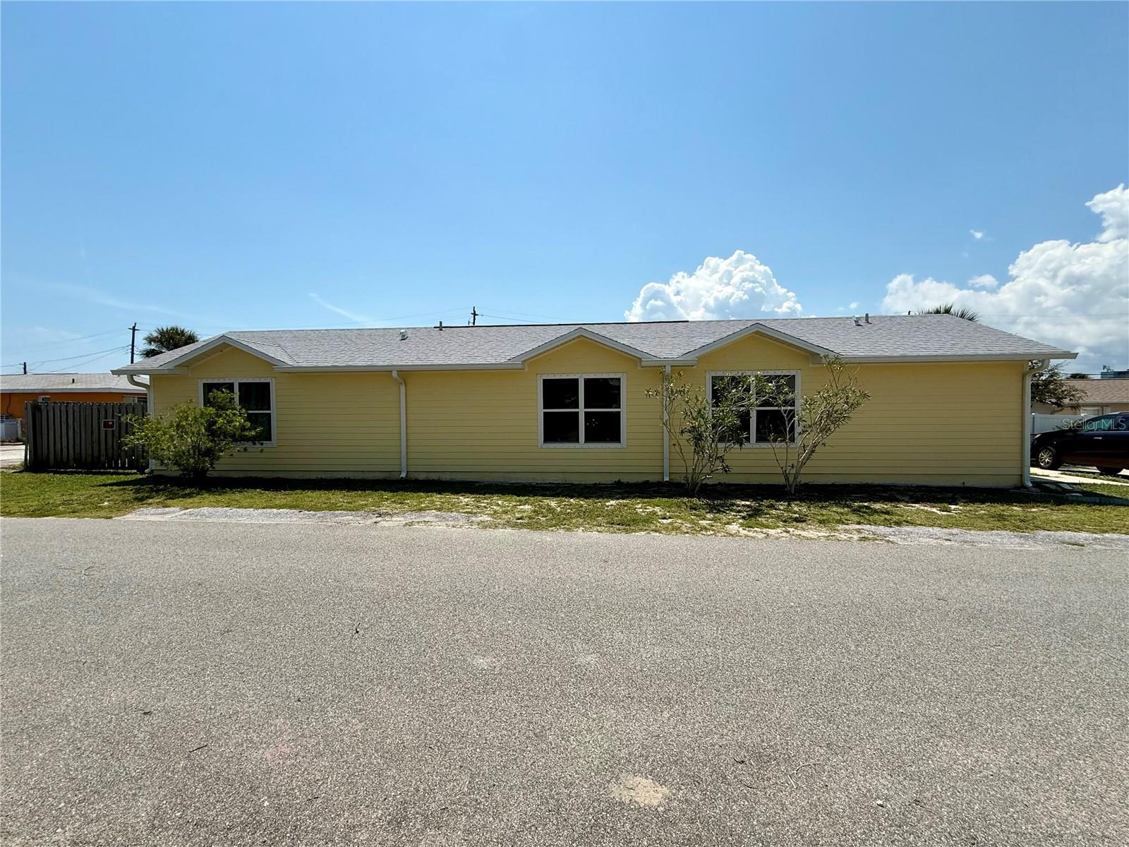 Prime location 3 lots west of A1A so it's a quick walk to the ocean. Home has 2 bedrooms and 2 bathrooms and the primary bedroom has an ensuite bathroom with walk in shower. This cute home offers everything you will need and feels open and spacious with the vaulted ceiling. One car garage and backyard is fenced for privacy. There is a quaint little garden area on the back right side of the yard and a nice patio area to sit and relax in the fenced in backyard. This home is bright and gives that home feel. It would be perfect for your primary home, second home or rental. Easy to maintain and has many updates - solar installed 2020 and will be paid off at closing, roof installed September 2024, Bryant A/C is March 2023 and Rheem water heater is August 2006, fenced backyard installed 2021 and home comes with hurricane shutters. The portable A/C in the garage will be staying with the home and it also has hurricane shutters.
Daytona Speedway is only 5 miles away, the ocean is about 650 ft away and there are some great restaurants and shopping close by. Daytona offers so many events like Nascar 500, Rolex 24, Nascar 200, Coke Zero 400, Rockville Music Fest, Art Festival, Jeep week, Bike week, Biketoberfest, Turkey Run, Concerts and so much more.