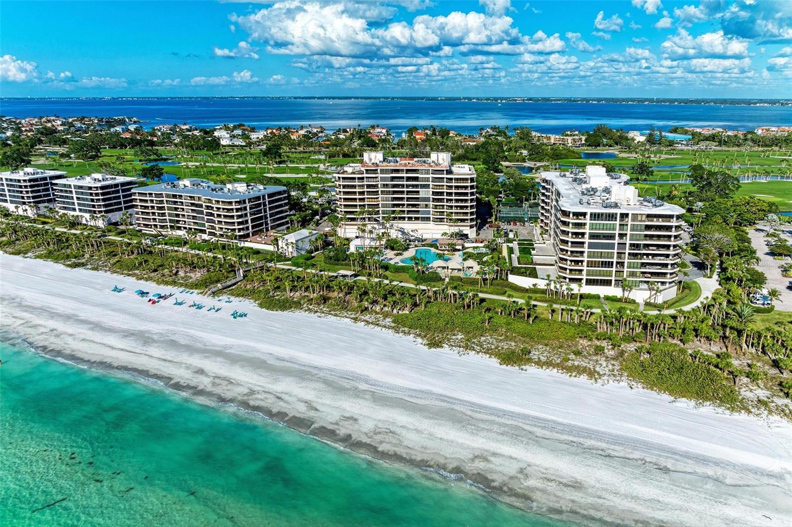 Welcome to a slice of paradise at The Sanctuary, where coastal living meets luxurious comfort. Apartment 504 presents an unparalleled opportunity to own an exquisite residence in one of Longboat Key's most prestigious communities. As you enter the large hallway immerse yourself in breathtaking direct views of the Gulf of Mexico meeting the pristine Longboat key beach and enjoy awe-inspiring sunsets from the comfort of your own over sized private balcony. This expansive (3115 sq ft )corner unit has 3-bedroom, 3 full and one 1/2 bathroom apartment plus bonus room boasts an open-concept floor plan, offering generous living spaces perfect for both relaxation and entertaining. (3rd bedroom currently used as a study/guest room) This fully furnished apartment features high-end finishes, including tiled floors, designer light fixtures and fittings, creating an ambiance of sophistication and elegance. The gourmet kitchen is equipped with top-of-the-line stainless steel appliances including 2 wine fridge's, a Miele built in coffee maker, a large warming drawer, custom cabinetry, and granite countertops, making cooking a true pleasure. To the side of the kitchen there is second balcony with views of downtown which offers stunning views at night. The master suite is a tranquil retreat with panoramic water views, a large walk-in closet, and a spa-like en-suite bathroom with a soaking tub and walk-in shower. The second en-suite bedroom offers complete privacy for your guests. Easy to lock up and go for seasonal owners with electric hurricane shutters. The Sanctuary offers an array of resort style amenities, including a private beach entrance, a large heated pool, tennis courts, fitness center, clubhouse, and 24-hour security. This unit has one large climate controlled storage cage and one under building garage parking space. Situated on the coveted Longboat Key, Apartment 504 enjoys a prime location, with easy access to Sarasota and the vibrant cultural scene, fine dining, and upscale shopping on St. Armands Circle and the new ST Regis Hotel. Experience the tranquility of coastal living while still being close to all the conveniences of city life and a publix and CVS within just a few minutes drive. Whether you seek relaxation by the water's edge, engaging in recreational activities, or exploring the nearby nature preserves, The Sanctuary provides an exclusive lifestyle that epitomizes coastal living at its finest. This is an exceptional opportunity to own a stunning residence in one of Longboat Key's most sought-after communities. Don't miss the chance to experience luxury living at its finest. New roof 2024 and Phase one Milestone inspection completed.