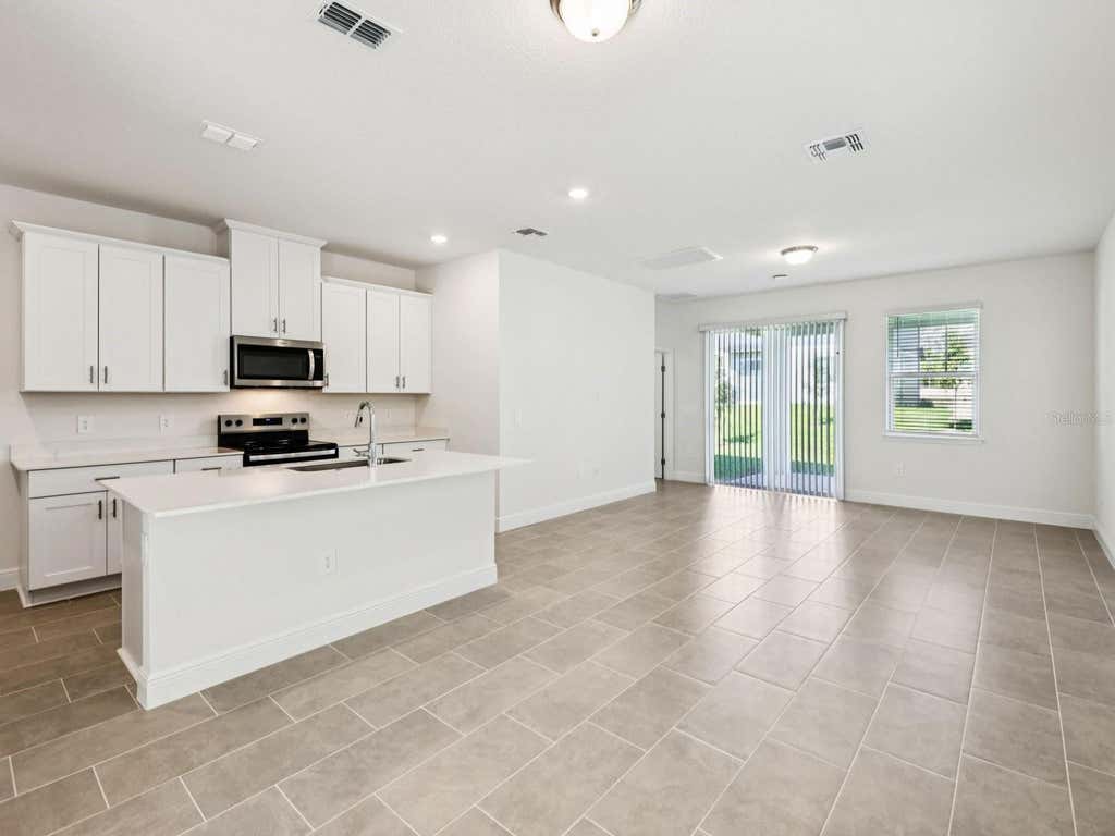 Photo of 2194 Wildberry Way, Minneola, FL 34715 (MLS # TB8534172)