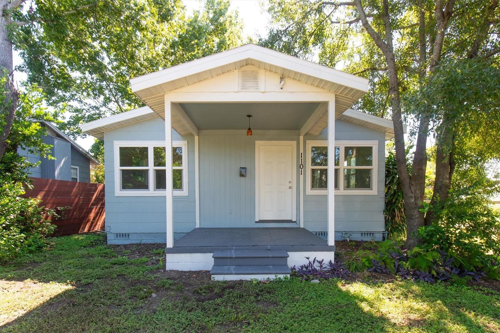 Welcome to this beautifully updated 2 bedroom, 2 bath bungalow with a detached garage in the heart of St. Petersburg. This home features fresh interior paint, gleaming hardwood floors, and abundant natural light throughout. The spacious living area flows into a modern kitchen with updated counters, stainless steel appliances, a farmhouse sink, and a striking backsplash. Both bedrooms are comfortably sized with two full bathrooms for added convenience. Outside, the oversized lot with mature trees offers shade and privacy, while the detached garage provides secure parking or storage. Perfectly located near downtown St. Pete, Tropicana Field, shops, restaurants, and the Gulf beaches, this move-in ready home blends classic charm with stylish updates.