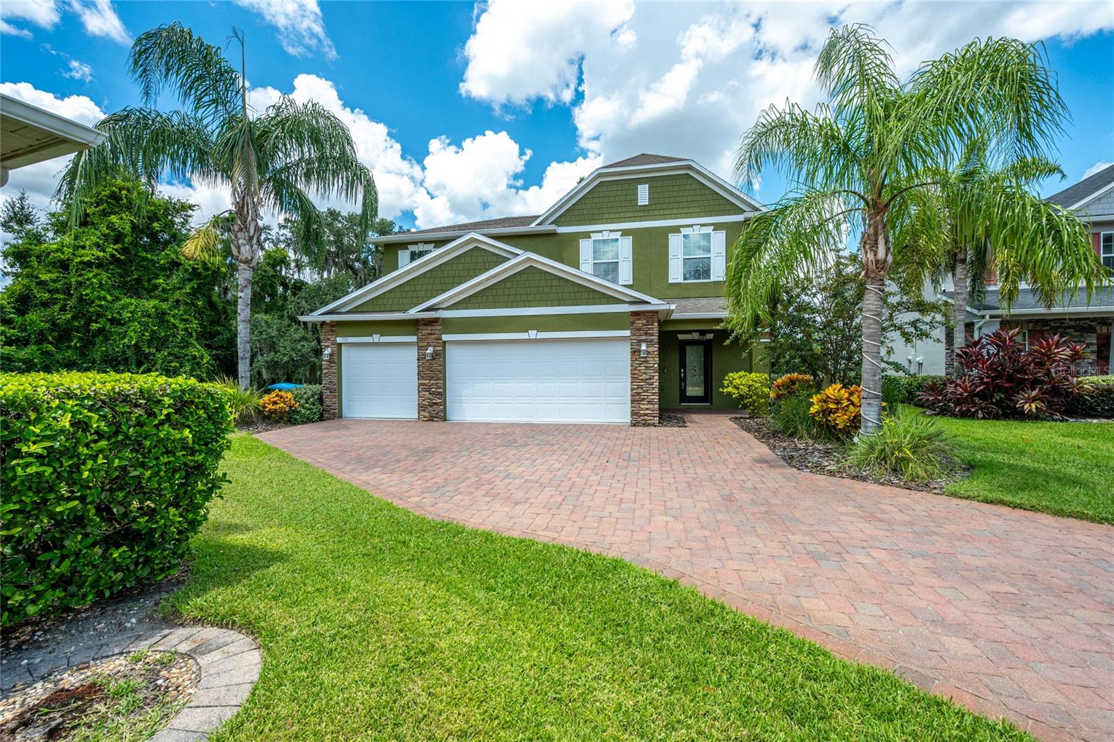 Tucked away on a quiet cul-de-sac in a private neighborhood, this move-in-ready 4-bedroom, 2.5-bath home offers a peaceful setting with tranquil water views for the family that enjoys fishing or paddleboarding in your backyard. Sitting on a spacious 0.32-acre lot, the property features lush landscaping, mature trees, and a long brick driveway leading to a 3-car garage. Inside, the open-concept layout connects the large family room to a modern kitchen with a center island, built-in oven, and mosaic tile backsplash ideal for everyday living and entertaining. Current owner upgraded the AC system with a Programable Pioneer 1.5 Mini Split to provide improved comfort on the main floor. The owner’s suite offers privacy, a Tray Ceiling, His and Her walk-in closets, the bath features a walk-in shower, and space to unwind. Three additional bedrooms are well-sized for family, guests, or a home office. Highlights include custom stairway woodwork, an indoor laundry room, and a convenient half bath on the main floor. Step outside to a screened-in patio and private dock, offering light water access perfect for relaxing, reading, or simply enjoying nature. The community refers to it as Little Lake Wildmere. This home combines comfort and peace of mind with a full irrigation system, installed gutters, and a comprehensive security system. Located in a serene, low-traffic community, this is the perfect opportunity for buyers seeking a quiet, water-view home with modern upgrades and a highly livable layout. The owner was not required to carry flood insurance, but did anyway, under $720 a year. Schedule your private showing today and see what Florida living feels like.
