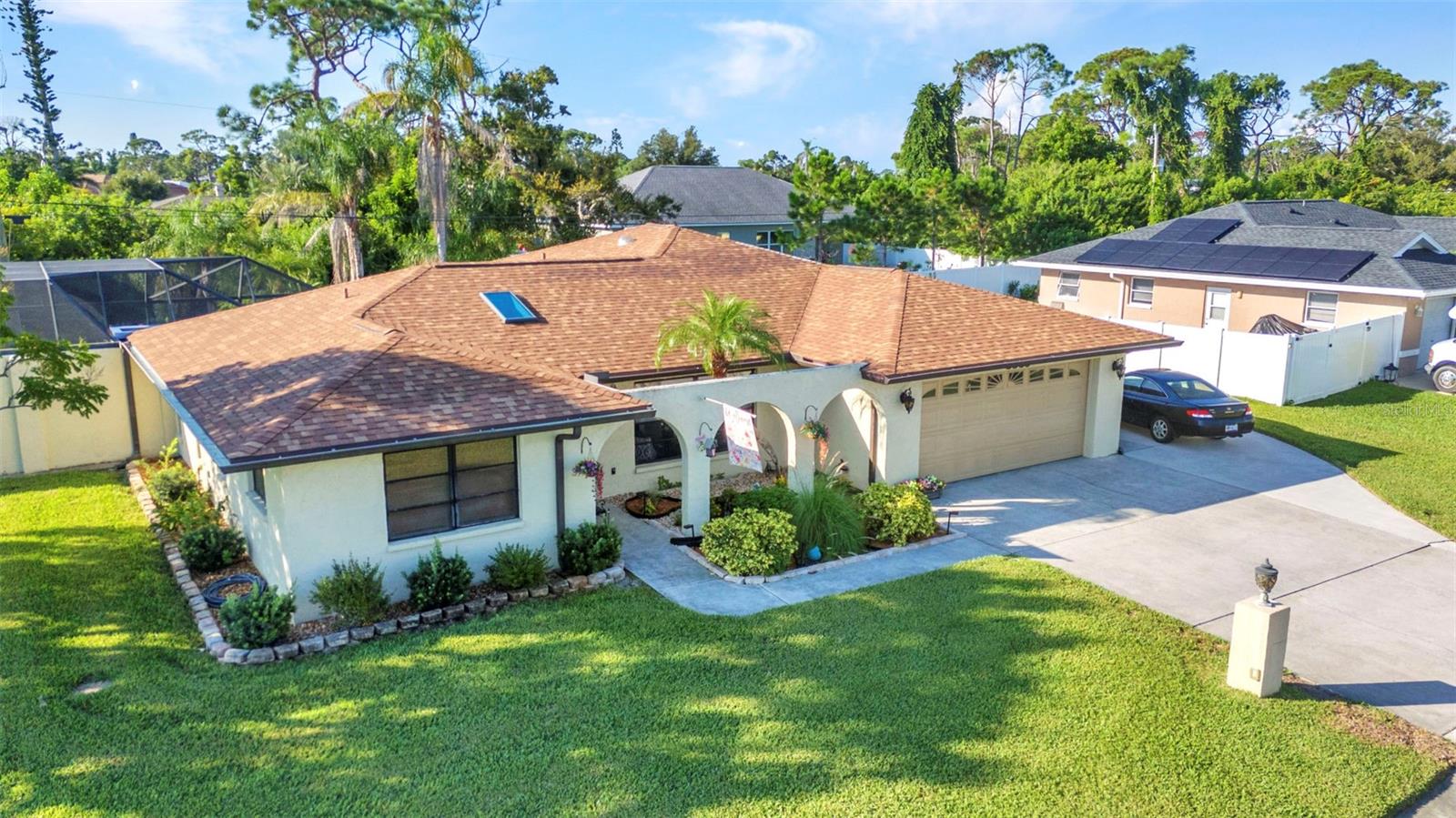 This immaculate and well-maintained home truly offers everything you’ve been searching for and more! Featuring 3 bedrooms, 2 baths, PLUS a versatile den/office/4th bed flex space, this property has the space inside and out designed to accommodate today’s lifestyle needs. Step inside to a spacious kitchen, dining and living room which flow together seamlessly and open onto your private backyard oasis. The entire pool area underwent a complete renovation in 2017, showcasing stunning Flagstone pavers that surround the resurfaced extra large 14 x 29 pool with PebbleTec "PebbleSheen" finish, elegant glass waterline tile, and a cozy firepit—the perfect setting for relaxing or entertaining. Major updates add incredible peace of mind and value: a NEW ROOF (2022) with transferable warranty, a 34K solar panel system installed in 2022 (current electric bill avg just $68/month), and C/A system (2018). Even more, a high quality Kinetico water softener system and a brand-new water heater (2025) complete the package. The 120 x 100 oversized lot has irrigation to keep your lawn and plants looking good! An extra concrete slab runs on the right side of the garage, perfect for boat or RV parking. This South Venice location comes with added benefits that provides an exclusive opportunity for an optional low fee membership to the community amenities including the SOUTH VENICE BEACH FERRY transportation to a private dock and beach area on Manasota Key, a kayak / canoe and paddle board storage area plus boat launch. This home is located just under a mile from Shamrock Park and the biking / walking path along the Intercoastal where the manatees and dolphins play. Just a short drive to the beautiful stunning Gulf beaches and historic downtown Venice with many boutique shops, sidewalk cafes and entertainment events. Recreational options are plentiful with world class fishing, boating, many area golf courses, tennis courts, and so much more. A short drive to the upcoming Wellen Park community with an abundance of shopping and dining options in the nearby area. NO CDD fees, NO deed restrictions or HOA fees! If you are looking for a permanent home, investment or vaca property, this one checks all the boxes! This home blends modern efficiency with resort-style living—move-in ready and waiting for you!