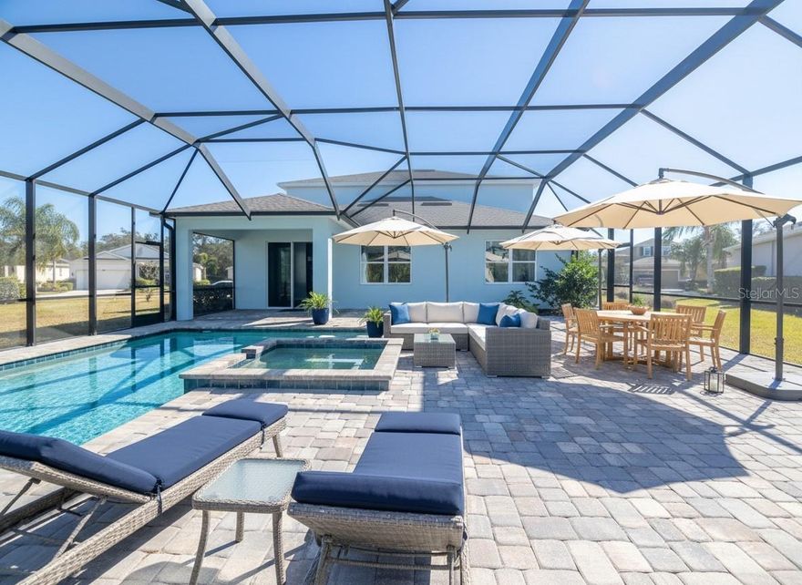 One or more photo(s) has been virtually staged. This impressive 5-bedroom, 2.5-bath residence sits on a generously sized lot in the Fairways at Bent Tree in close proximity to Bent Tree Country Club. Enjoy the convenience of nearby golf without mandatory membership fees, offering flexibility and an exceptional lifestyle opportunity. Inside, the open-concept floor plan and high ceilings create a bright, expansive atmosphere ideal for both everyday living and entertaining. The thoughtfully designed kitchen—uniquely inspired by a popular Hulu series—features granite countertops, stainless steel appliances, a center island, and a spacious pantry, making it as functional as it is stylish.  The home offers abundant space for every need, including a dedicated office and a large upstairs bonus room perfect for relaxation, recreation, or additional living space.  This home has everything you need to move right in! A new roof, sparkling saltwater pool and spa with cage were installed in 2023. A new A/C, LG washer and dishwasher were installed in 2025. This same year, the home got new carpeting throughout the second floor and stairway, fresh interior paint upstairs, new dual sinks in the primary bathroom, and a newly painted exterior. It also has energy-efficient double-paned thermal windows throughout.  Located within an excellent school district and just minutes from I-75, this home offers easy access to the airport, University Town Center Mall, and world-famous Gulf Coast beaches including Siesta Key. Experience the best of Florida living—outdoor enjoyment, beautiful sunsets, and everyday convenience!