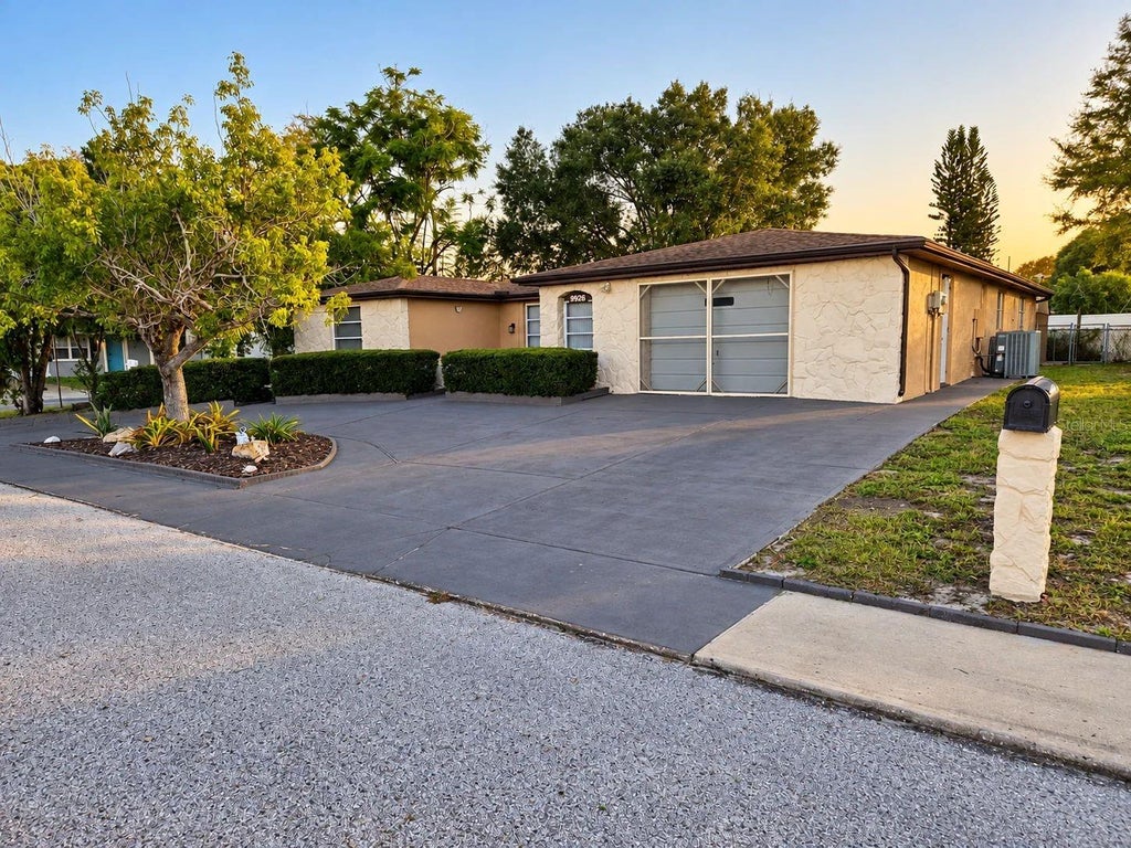 Photo of 9926 Lakeside Lane, Port Richey, FL 34668 (MLS # W7889048)