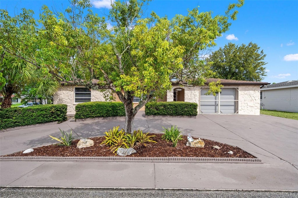 Photo of 9926 Lakeside Lane, Port Richey, FL 34668 (MLS # W7889048)