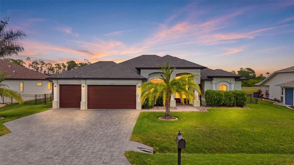 Photo of 12894 SW Pembroke Circle S, Lake Suzy, FL 34269 (MLS # TB8502685)