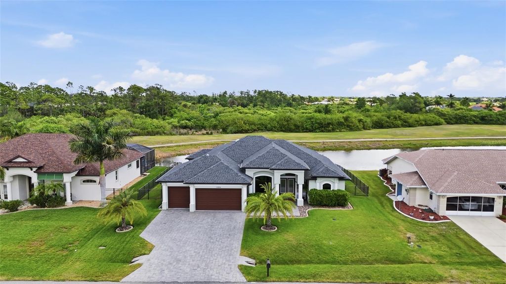 Photo of 12894 SW Pembroke Circle S, Lake Suzy, FL 34269 (MLS # TB8502685)