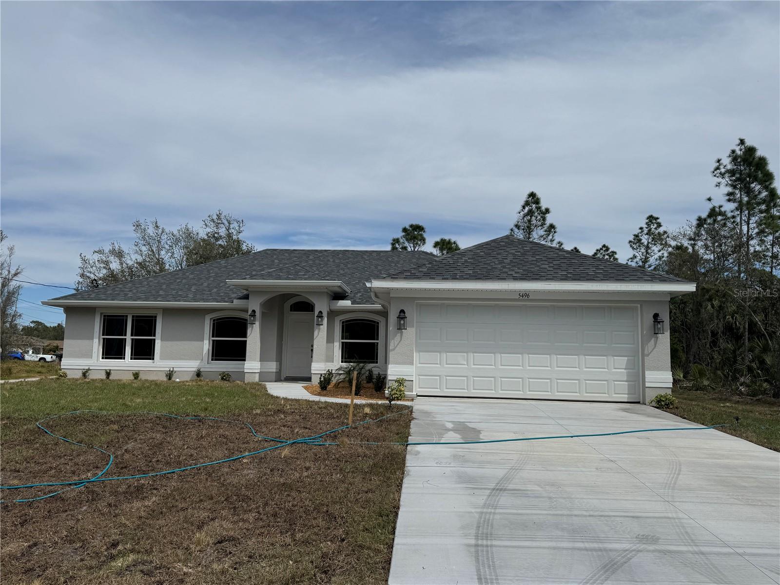 Under Construction. This charming North Port home offers the perfect blend of affordability and natural beauty. This property provides easy access to outdoor recreation, including kayaking on nearby waterways and enjoying the lush greenery of Myakka River State Park, and churches. This New Construction home is located in the North Port Estates area and is ready for occupancy! The home has 1860 square feet in living space allowing you much room for your family as well as guests. The extended patio space gives perfect extra room for outdoor enjoyment. Adams Homes provides great features such as: architecturally designed elevations, updated window designs, stain resistant carpet, brushed nickel door and bath hardware, designer LED recessed lighting, 36" upper cabinets with crown molding, double pane insulated tilt-in sash windows and much more. 10 year builder structural warranty included! This is the opportunity to make this affordable gem your new family home. Paid closing costs available with use of a preferred lender!