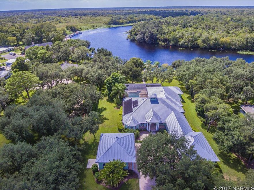 The beautiful St Johns River is the setting for the stunning custom built home situated on 4 acres.  A beautifully designed and decorated casual coastal direct riverfront home in the North Orlando area close to the Sun Rail, great shopping, fine dining, and several airports.  The interior of this home will take your breath away and the river views and sunsets are spectacular.  Situated at a high elevation with a floating dock with two boat slips, solar heated pool and lanai, fire pit and riverfront screened gazebo.  There is a separate RV Garage built to accommodate 2 RV's.  Beautifully landscaped property consisting of over 4 pristine acres with flowering shrubs, large oak trees and a private 800 foot driveway. This is truly one of those homes and properties that must be seen to fully appreciate the beauty, location, and quality of workmanship that went into the design and building of this custom home. ;Water: City