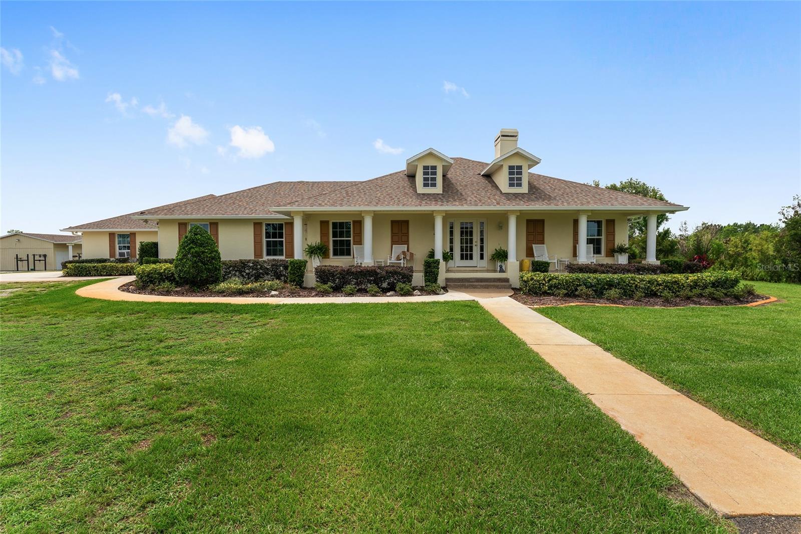 Welcome to this Immaculate Farm, a move-in-ready equestrian estate tucked away at the end of scenic Old Grove Road in beautiful Clermont, Florida. Spanning over 24+ acres, with the main residence situated on 7+ acres private and with security gate. Located just outside the growing city of Clermont and by Lake Louisa State Park. Louisa State park offers about 15 miles of horse trails and also Equine camping opportunities. This turnkey property is thoughtfully designed for both comfortable living and premium horse care. At the heart of the farm is a spacious 3-bedroom, 2-bathroom ranch-style home offering over 2,500 sq ft of updated living space. Paved driveway up to the home where you will enjoy panoramic views of the horse facilities from nearly every angle. The home features a split floor plan for enhanced privacy, exterior paint (2025), and all-new roofs on every building (except the shed) and fencing completely repainted in 2024. The home features a light-filled living room that flows into a private dining room. A kitchen and bathrooms with quartz countertops and modern finishes. Renovated bathrooms with fresh, updated design and quartz counter tops. A master suite extension with private hallway, large 7' x 17' walk-in closet. An expansive laundry area with 20+ ft of built-in storage. A newly added 2-car garage with a half bath. A bonus office/playroom (20 x 12) with walk-in closet.
For horse enthusiasts, the property is truly a dream with 6 irrigated pastures, each equipped with Nelson automatic waterers. A 75’ x 130’ riding arena at the entrance which includes a 12’ x 30’ shed with electricity—perfect for additional storage. The arena has water available for horses. The farms has Two barns:
• 2-stall barn with runs
• 4-stall barn with large tack room with dehumidifier and feed room with AC wall unit
Ride around the property on the outside the fenced pastures. One of the pastures includes a round pen. On top of all of these, the farm has Two RV hook-ups (50 AMP and 30 AMP); two wells to support the home and the farm’s irrigation needs.
Just a short drive to Orlando, Ocala, and Tampa. Whether you're looking for a full-time residence or a seasonal retreat, This farm offers an exceptional blend of rural tranquility, equestrian functionality, and modern comfort. Don't' miss this opportunity to enjoy central Florida at its best.