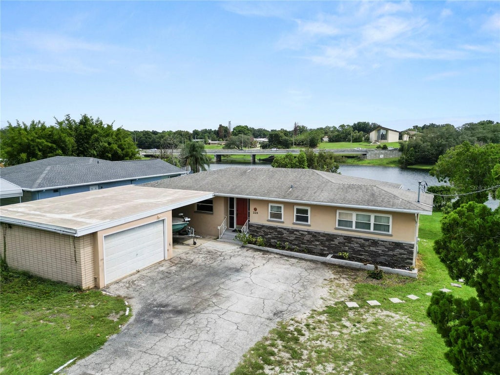 Photo of 228 W Lake Ina Drive, Winter Haven, FL 33884 (MLS # L4963984)