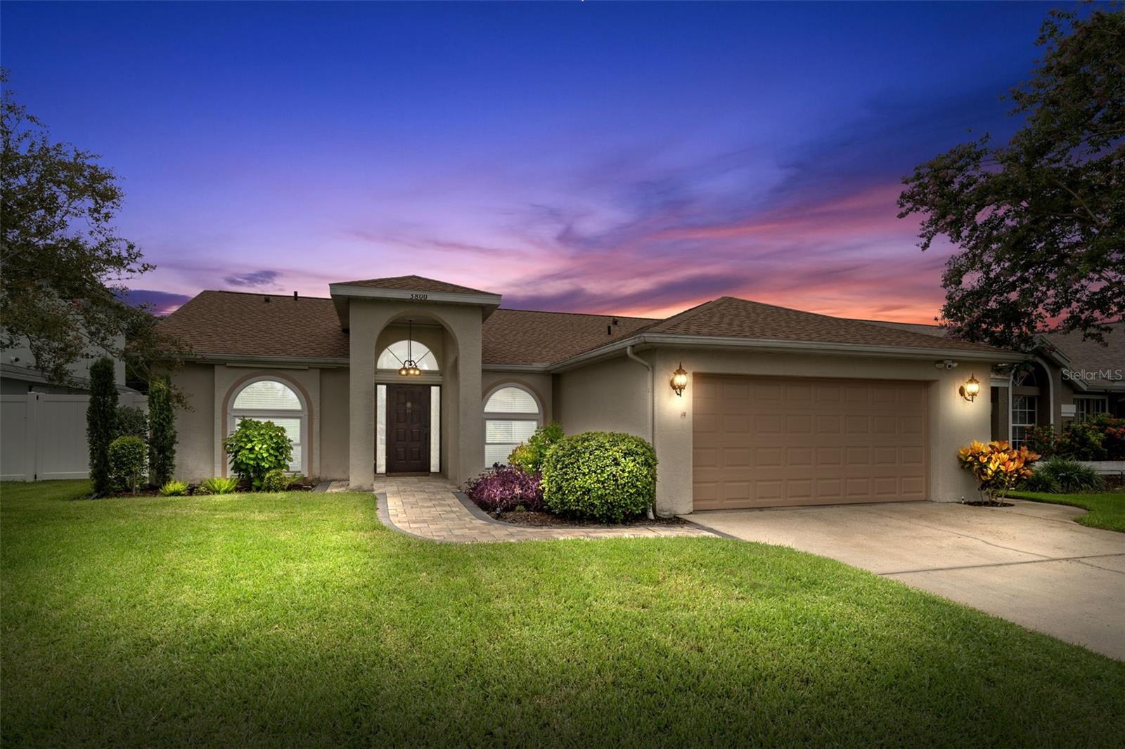MOVE IN READY home located in the much-desired Lakes community. 3 Bedroom, 2 Bath POOL HOME with 2 car garage. This beautifully maintained home with a heated saltwater pool offers the perfect blend of style, comfort, and updates — homes with a private pool don’t come available often! The seller spend over 90K in upgrades over the past few years making this home a must see! This home has been thoughtfully updated with UPDATED FLOORING with 48 hour waterproof luxury laminate flooring throughout and BASEBOARDS UPGRADED (Dec 2020), NO POPCORN CEILINGS, INTERIOR and EXTERIOR LIGHT FIXTURES REPLACED (Dec 2020), HOT WATER HEATER (Jan 2021), HURRICANE IMPACT WINDOWS (Jan 2021), HVAC (Jan 2021), PEBBLE TEC POOL RESURFACED (April 2022), VARIABLE SPEED POOL PUMP (approx 2023) SALTWATER CHLORINATION system (2021) and a WHITE VINYL FENCE (May 2022) Sliders with Roll down Hurricane shutters. Additional improvements include a NEW ROOF with transferable warranty (approx. 2.5 years old) Garage door opener and washer & dryer (approx. 4.5 years old). Ideally situated just minutes to I-275 for easy commutes to Tampa or St Petersburg and close to the gorgeous Gulf beaches, this home embodies the Florida lifestyle. The smart split-bedroom floor plan ensures privacy and function. The spacious primary suite is a serene retreat with vaulted ceilings, sliding doors that open directly to the screened pool area, an ensuite bath featuring dual sinks, soaking tub, separate shower, walk-in closet. On the opposite side of the home, two additional bedrooms (one currently used as a sitting room) and a full guest bath complete the layout. The open and airy living room impresses with vaulted ceilings, a skylight, and a cozy fireplace, 2 sets of sliders out to the pool, while the kitchen offers abundant cabinetry, granite countertops, and a sunny dining area framed by an arched window. A breakfast bar provides extra seating and a perfect spot to gather. An indoor laundry room and two-car garage add convenience. Step outside to your private oasis — the screened-in Heated saltwater pool and patio area with pavers, covered area, and tropical landscaping is perfect for entertaining or unwinding with friends or family! Homes like this in The Lakes are rare and sell fast — don’t wait! You will enjoy all of the ammenties that the Lakes offers: Playground, tennis courts, community Gazebo that is located on a beautiful lake with walking trails. The Lakes is an beautiful community with an active social committee. Located in a Non-Flood Zone! Schedule your showing today before it’s gone!