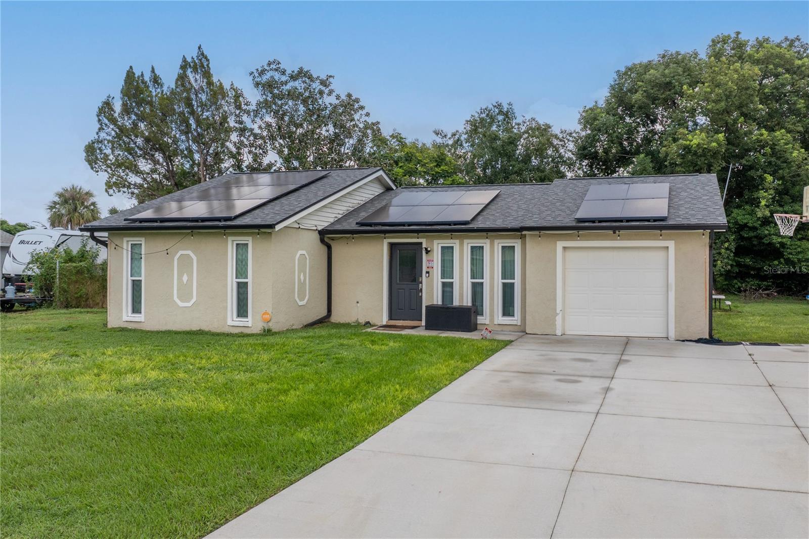 Welcome to 143 Guaymas Drive in Kissimmee, a beautifully REMODELED home where no detail has been overlooked. Built in 1980, this residence has been transformed with over $100,000 in UPGRADES, offering MODERN STYLE and peace of mind for years to come. The kitchen and bathrooms showcase CAMBRIA QUARTZ countertops paired with NEW CUSTOM CABINETS complemented by ELEGANT LIGHTING FIXTURES that enhance the home’s fresh and contemporary feel. LUXURY VINYL FLOORING flows seamlessly throughout, while brand new PGT HURRICANE IMPACT WINDOWS provide security and efficiency. Major systems have already been taken care of with NEW PLUMBING AND NEW AC SYSTEM installed in 2022, a ROOF REPLACEMENT in 2021, and the addition of solar panels with a low monthly payment of just $170. This property comes with the added benefit of NO HOA, giving you freedom from restrictive covenants. Ideally located minutes from the FLORIDA TURNPIKE, shopping, and dining, the home also offers unbeatable convenience with Orlando International Airport just 20 minutes away, Disney Parks 25 minutes away, and Universal Studios only 20 minutes away. Meticulously remodeled and fully upgraded, this move-in ready home is perfect for a first-time homebuyer, investor, or those seeking a second home in the heart of Central Florida.