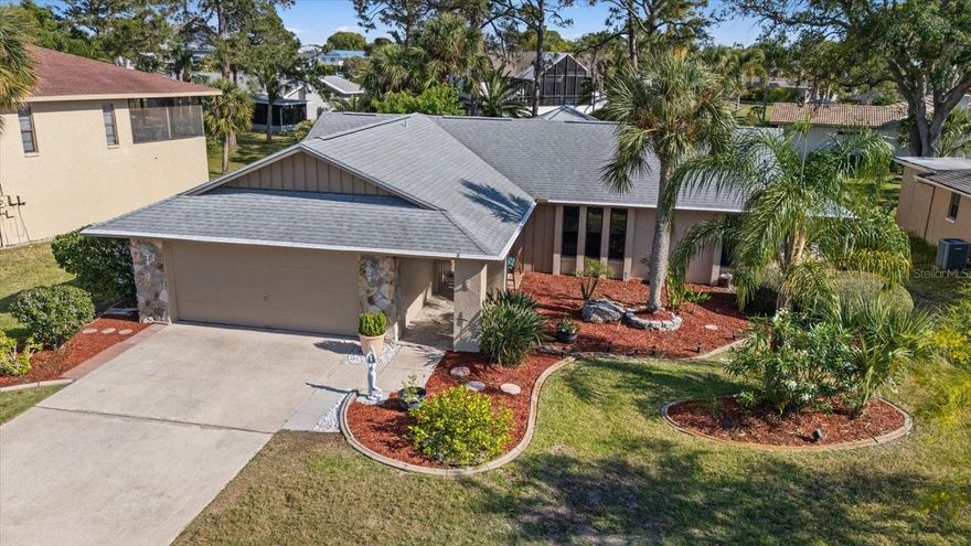 One or more photo(s) has been virtually staged. Welcome to this beautifully and NEWLY UPDATED and freshly painted home in the highly sought-after Gulf Harbors Woodlands community! Seller offering $10,000 in seller closing assistance-says "Let's make a deal!"-- Featuring 3 spacious bedrooms and 2 full baths, this 1,906 sq. ft. residence offers NEW TOP QUALITY AC in 2024, a bright open floor plan with luxury vinyl and tile flooring throughout. NEWER ROOF (2020). The stylish kitchen boasts BRAND NEW STAINLESS APPLIANCES, whole-house water softening system, Cambria Quartz custom counters, breakfast bar seating, NEW Cabinets with roll out shelving and a spacious, convenient pantry.  This is a split floorplan, with the primary suite located on the opposite side of home, apart from 2 other bedrooms and full bath. This spacious primary features a walk-in closet and an elegant ensuite bath with modern tile shower, space for vanity table with mirror or linen cabinet. Primary also has unique direct access door from garage.
Enjoy peaceful OLD STYLE relaxed Florida living on the enclosed rear lanai while enjoying a beautifully landscaped yard  with tropical vegetation for privacy. 
Additional highlights include: indoor laundry room with sink, 2-car garage, irrigation system, and plenty of natural light from vaulted and tray ceilings. The $60/month, Deed Restricted HOA fee provides peace of mind and includes these community amenities: a sparkling pool with amazing SUNSET VIEWS, pickleball/tennis courts, and PRIVATE BOAT RAMP with direct DEEP WATER Gulf access. 
Members Only benefits for The Woodlands residents include RARE opportunity to join Gulf Harbors Beach Club( $200/yr) and (for another annual fee$)Gulf Harbor Yacht Club(restaurant/events/social activities)No boat ownership required! 
Conveniently located near downtown New Port Richey, restaurants, shopping, and popular public beaches and parks. This home combines affordable, comfort, style, and an unbeatable coastal lifestyle—schedule your private showing today!
