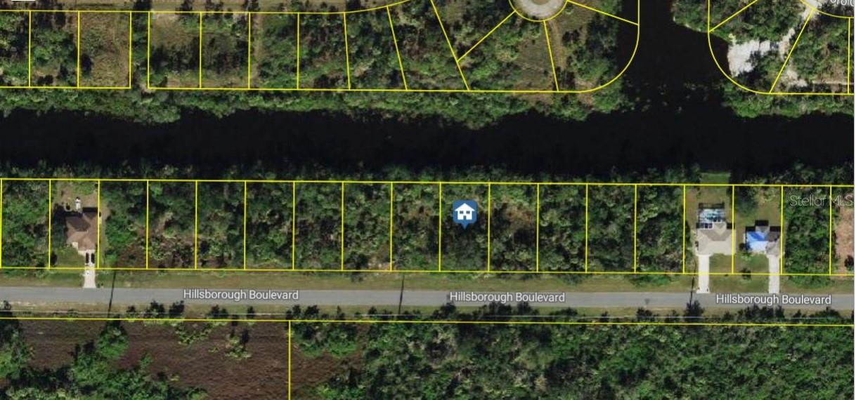 EXCEPTIONAL WATERFRONT lot located on the freshwater Cocoplum Waterway. This buildable, oversized quarter-acre parcel offers the opportunity to expand ownership to over half an acre with the adjacent Lot 14 (MLS ID: C7512546). Whether you intend to develop immediately or invest for the future, this property is a valuable addition to any portfolio. The proximity to I-75 gives convenient access for those commuting north to Tampa or south to Fort Myers, making this location ideal for travelers. North Port is recognized as the second most rapidly growing community with a rural emphasis. The property is situated within a short drive of the Gulf of Mexico’s coastal waters in both Englewood and Port Charlotte. Residents also enjoy nearby amenities including shopping, dining, the Atlanta Braves Spring Training Complex, and The Warm Mineral Springs. Furthermore, the area boasts top-rated, “A” grade schools, contributing to North Port’s reputation as a desirable place to live. With no HOA or CDD fees, this lot offers excellent opportunities for outdoor recreation such as fishing, kayaking, and boating, making it an ideal site to build your dream home in this thriving community.