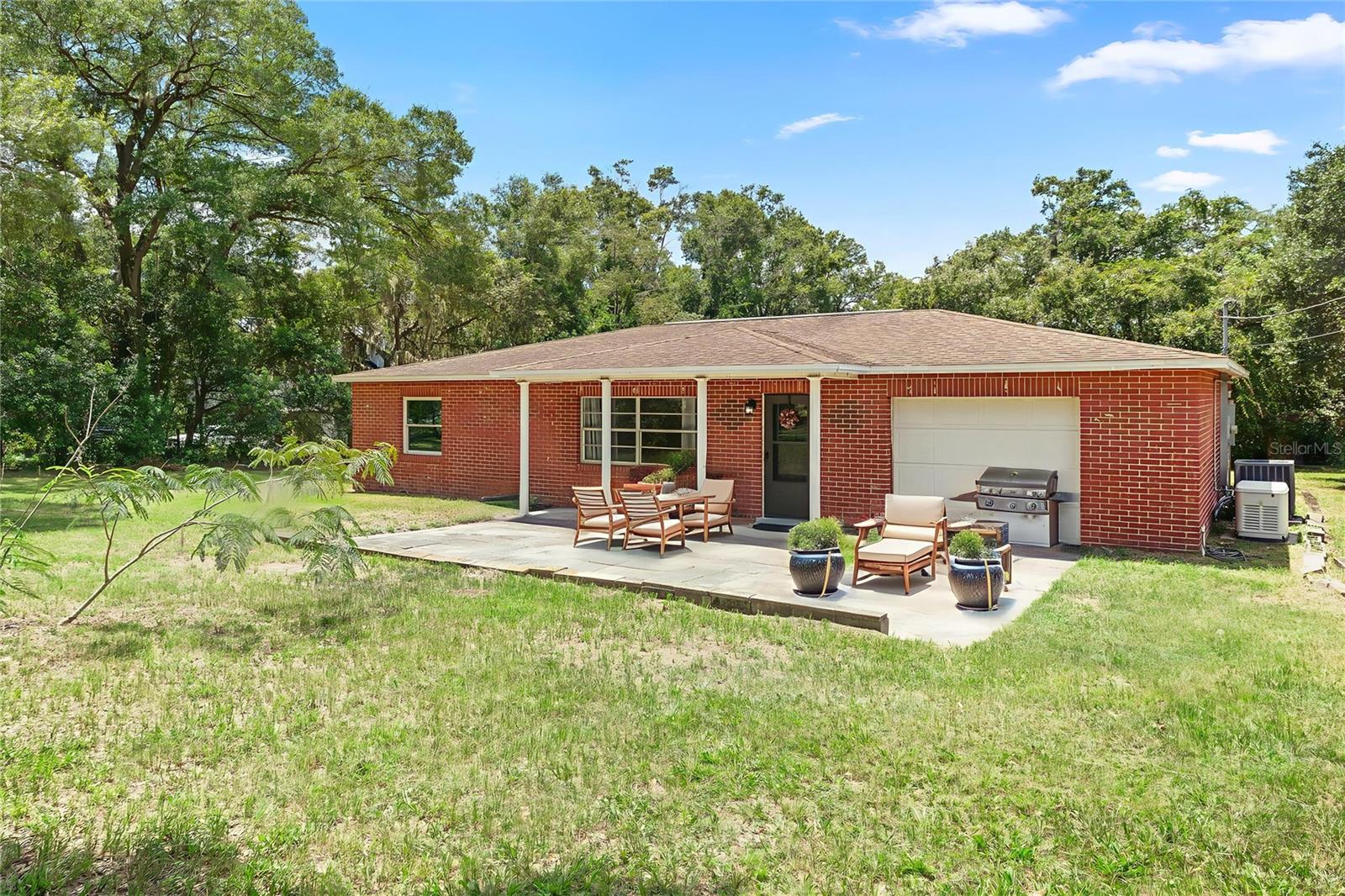 One or more photo(s) has been virtually staged. DELAND: Welcome home to this 2 bedroom, 2 bathroom home with over 1400 sq ft on an oversized partially fenced 1.25 acre lot. WOW! So much property to enjoy! The home features a large living room with ceiling fan to keep the space cool and large windows to allow for natural light to fill the home. The open kitchen offers a ceiling fan, stainless steel appliances and plenty of counter and storage space. There is space in the kitchen for a dinette area for easy meals. Off the kitchen is a bonus room that would make a great office to work from home. The Florida room is a great spot to enjoy reading your favorite books while enjoying views of the property. The Primary bedroom boasts a ceiling fan, walk in closet and En Suite bathroom with a large walk in shower. Additional bedroom is spacious and there is a full guest bathroom with shower/tub. The location is private while still being close to shopping, restaurants and all Deland has to offer. Make your appointment today to see this great home and property!