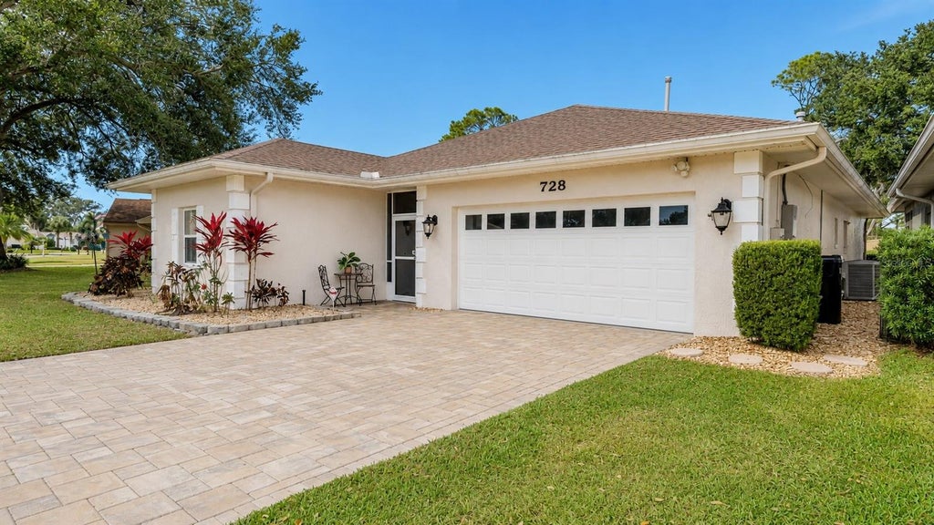 Photo of 728 Canberra Road, Winter Haven, FL 33884 (MLS # P4939181)