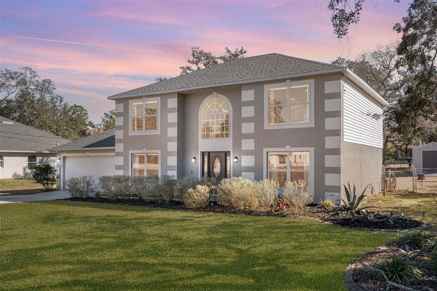 Welcome to your dream home in the highly sought-after Royal Highlands area! This charming two-story home, built in 2004, sits on a spacious half-acre lot and offers 3 bedrooms, (den could make a possible 4th bedroom) 2 full & 1 half bathrooms, as well as a 2 car garage. With its flexible layout and multiple living spaces, this home is ideal for a growing or multi-generational family seeking both comfort and versatility. New recent updates include, exterior has been freshly painted, and the interior features new luxury vinyl flooring throughout, along with new light fixtures and ceiling fans that give the home a modern, cohesive feel. The main level offers a formal dining room and a versatile flex space with custom, built-in shelving, this room is currently used as a playroom—full of possibilities to be used as a home school room or additional living area. The kitchen has been beautifully modernized with stunning sage green & white two-tone cabinetry, stainless steel appliances, granite countertops, a centered island, pantry and updated lighting, all opening to the spacious family room. Just off the kitchen is a dedicated eat-in dining nook positioned between the kitchen and family room, creating a perfect flow for both everyday living and entertaining. A convenient half bath and laundry closet complete the first floor. Upstairs, you’ll find all three bedrooms plus a dedicated office with a closet, offering flexibility to be used as a fourth bedroom or a second living space. The primary suite is generously sized and features a walk-in closet, garden tub, and separate toilet room with a walk-in shower. Step through the sliding glass doors onto the 12x16 screened-in back porch, overlooking the fully fenced backyard with plenty of room to add a pool or store your boat and ATVs. There is an established garden set up, ready for spring planting as well as fruit trees to include the following bananas, lemons, limes, elderberry, mulberry, blueberries and grapes for you to enjoy in the future! The property includes a 12x24 shed with 220-amp service, perfect for a workshop, hobby space or just extra storage. With no deed restrictions, HOA, or CDD, the property offers true freedom—including the ability to keep chickens. Additional highlights include a new roof installed in 2022, HVAC 2017,  reverse osmosis system and private well and septic for lower utility costs! Wonderful location, tucked away from the hustle & bustle but still conveniently located close to shopping, restaurants, schools, Oak Hill Hospital and just minutes from the Suncoast Parkway for an easy commute to Tampa. You’re also located in close proximity to Weeki Wachee State Park, Rogers Park, Pine Island, and more. Don’t miss your chance to own this beautifully updated home—schedule your showing today!