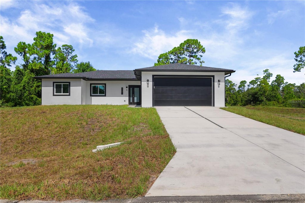 Photo of 828 Genoa Avenue S, Lehigh Acres, FL 33974 (MLS # C7528591)