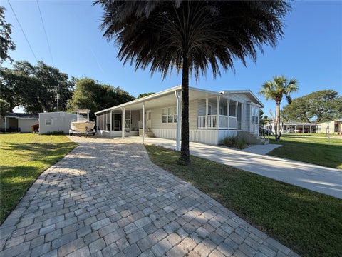 Photo of 152 Red Bass Lane, Edgewater, FL 32141 (MLS # O6430146)