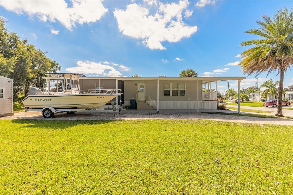 Photo of 152 Red Bass Lane, Edgewater, FL 32141 (MLS # O6430146)