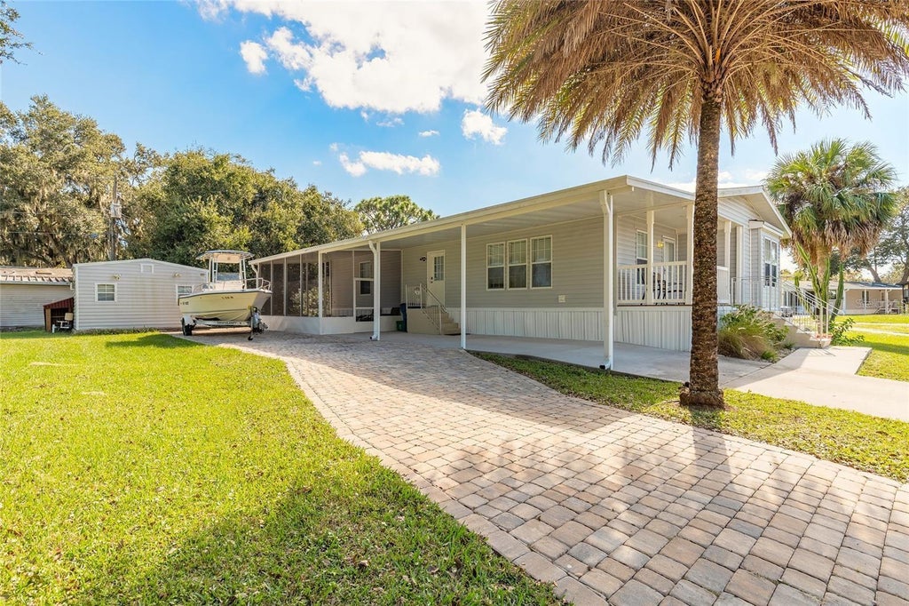 Photo of 152 Red Bass Lane, Edgewater, FL 32141 (MLS # O6430146)