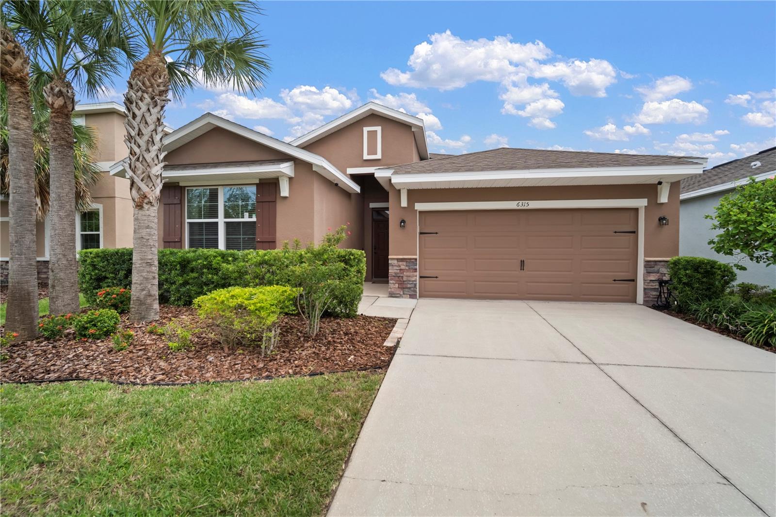 Welcome to this beautifully maintained single-story home in the highly sought-after Waterset community, offering 4 bedrooms, 3 full bathrooms, and a versatile office/flex space. With 2,315 sq. ft. of thoughtfully designed living space, this home combines modern comfort with practical upgrades.
Inside, you’ll find an open-concept layout with no carpet throughout and a whole-home reverse osmosis system for pure water convenience. The kitchen flows seamlessly into the living and dining areas, creating the perfect space for entertaining or everyday living.
The spacious primary suite offers a private retreat, while three additional bedrooms and two full bathrooms provide room for family or guests.
Step outside to enjoy Florida living at its best on the large covered and screened lanai overlooking a fenced backyard with a firepit, ideal for gatherings, relaxing evenings, or playtime.
Located in Waterset, residents enjoy resort-style amenities including multiple pools, fitness centers, walking trails, playgrounds, dog parks, and more.
This home truly has it all, modern upgrades, functional space, and an unbeatable community lifestyle.