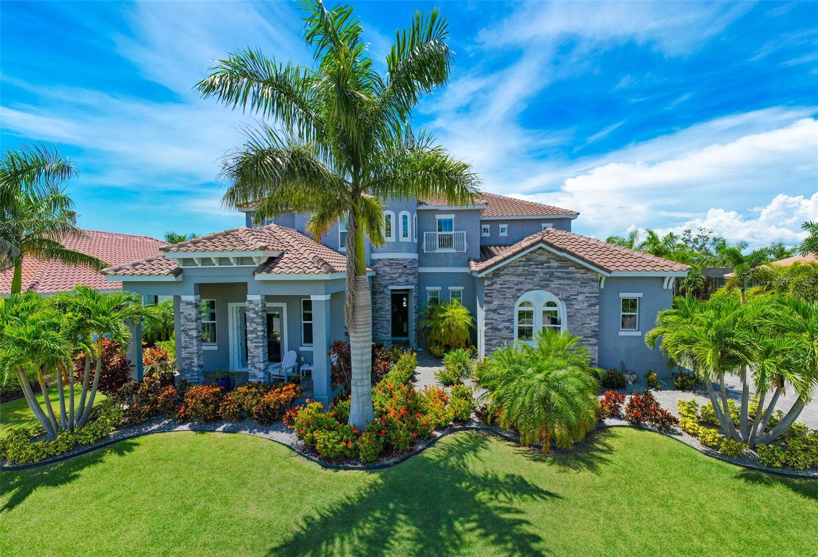 Come visit- Open house!! Sat, Aug 16 from 12:00 PM - 2:00 PM!! Get ready to FALL IN LOVE!! Welcome to 832 Manns Harbor, a breathtaking 6-bedroom, 5 full-bathroom, 2 half-bathroom home nestled in the highly sought-after community of MiraBay in Apollo Beach. This luxurious residence is an entertainer’s dream, featuring soaring 12-foot ceilings, an expansive open floor plan, and a seamless connection between indoor and outdoor living.
Step outside and be captivated by your very own private oasis – a massive pool and spa complete with a custom rock grotto, fully equipped outdoor kitchen, and expansive patio areas designed for both hosting and relaxing. Whether you're firing up the grill for a summer barbecue or unwinding with loved ones under the stars, the outdoor space offers unparalleled comfort and beauty. The home is situated on an extra-large lot, backing up to lush conservation land for ultimate privacy – a rare find in MiraBay, where most properties are not fortunate enough to have such seclusion.
Inside, thoughtful design meets exceptional functionality. The first-floor master retreat offers a spacious, serene escape with private pool access and a spa-like en-suite bath. A first-floor mother-in-law suite provides comfort and privacy for guests or extended family, while the large first-floor office with a separate entrance is perfect for working from home or running a business. The gourmet kitchen is a chef’s dream, equipped with high-end appliances and ample counter space, while the expansive living and dining areas are perfect for gatherings or quiet nights in.
Upstairs, you’ll find a giant loft ideal for a game room, play area, or casual hangout, as well as a dedicated theater room for immersive movie nights. With laundry rooms on both floors, everyday living is made even more convenient. Adding to the home’s value and efficiency, solar panels significantly reduce energy costs while supporting sustainable living.
Located in the heart of MiraBay, residents enjoy resort-style amenities, including a clubhouse, fitness center, and direct access to the bay for boating and water sports.
Don't miss out on this extraordinary home – schedule a private showing today and make 832 Manns Harbor your next address!