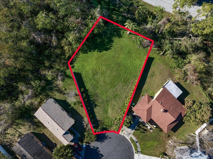 Amazing cul-de-sac lot looking over Taylor Park lake.  Unique and quiet lot with a fresh water stream on the rear of the property surrounded by nature.  Walking distance to Taylor Park with outdoor recreation facilities, jogging & biking trails, a fishing lake and lots of wildlife.   Ready to build & no HOA Fees.  Centrally located in Pinellas County, only minutes to the beach!