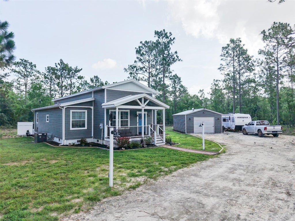 Photo of 13971 SE 82nd Lane, Dunnellon, FL 34431 (MLS # OM726829)