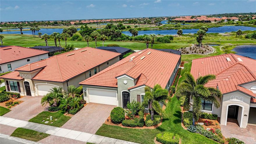 If you ever wanted to live on a golf course, then this home is just perfect for you! Located in the Golf Village of Sarasota National, this WCI built home has a spectacular water and golf course view with beautiful sunrises giving you one of the best vistas in the community! Situated just off the 9th tee, this 3 bedroom, 3.5 bath open concept Key Largo floorplan has 2,386 sq ft of stunning features. The home is being offered with most furniture, and features many desired upgrades showing 10 foot ceilings, 8 foot doorways, screened front entry, custom plank ceramic floor tile, ceiling fans, custom plantation shutters, an alarm system, and crown molding is featured throughout most of the home. The gourmet kitchen has a beautiful free-standing island with granite countertops, gorgeous cabinets, upgraded decorative tile backsplash, a coffee nook, and a large walk-in pantry. Conveniently located near the kitchen is the home's half bath. The Great room enjoys a gorgeously decorated tray ceiling, a cozy dining area, and sliding glass doors that open to a large, covered lanai. Fully opening the sliding glass doors offers the perfect entertaining space provided by the Kitchen, Great Room, and Lanai combination. This home has the perfect outdoor space for friends and family featuring a custom heated saltwater pool, complete with a travertine pool deck, and a custom outdoor kitchen. To complete the outdoor space, the lanai is equipped with a remotely operated Storm Smart hurricane screen and elegant shiplap planking installed on the lanai ceiling. The Primary Bedroom suite offers beautiful water views, a massive closet, and an Ensuite bath with two separate sinks, and a luxurious walk-in tiled shower. You and your guests will love the privacy afforded with the two guest bedroom ensuites, on the opposite side of the home. The den has custom sliding doors that add a unique touch to the home’s décor. The den also boasts a custom installed business center! Even better is this home has a new air conditioning system! The 2 car garage is outfitted with an epoxy floor coating. Further, this home includes 2 bundled Golf Memberships. Sarasota National is one of the Venice area’s most sought-after communities with a 30,000 sq. ft. clubhouse, spectacular zero entry resort style pool with spa and lap pool. Enjoy casual dining at the Tiki bar, fine dining at the Palm Club, a 7,000 sq. ft. fitness center with classes, personal trainers, and day spa, pickle ball, lighted tennis courts, bocce ball, coffee house, 18-holes of championship golf, and a magnificent 19th hole restaurant. Sarasota National is also a Silver rated Audubon Bird Sanctuary with more than half of the community being designated as a preserve. Sarasota National is less than 15 minutes from historic downtown Venice, shopping, and world-class beaches. Come and see how you can live like you’re on vacation every day!