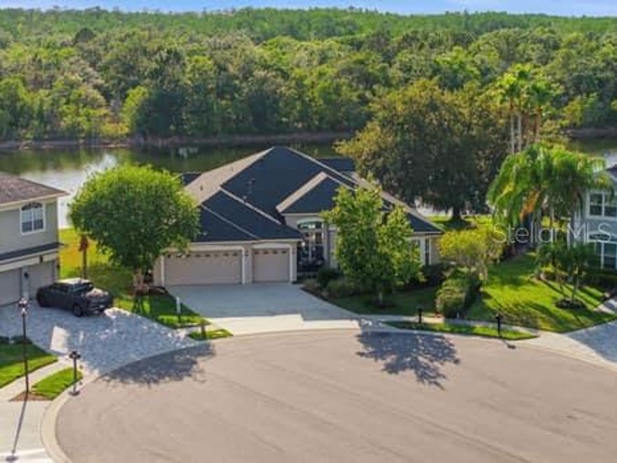Experience refined “quiet luxury” at 6113 Cognac Circle, ideally situated in the exclusive gated CHEVAL Golf and Country Club. This exceptional 5-bedroom, 4-bath residence offers 3,136 sq ft and is positioned on a rare premium lot featuring serene lakefront views, a permanent conservation buffer, and a private cul-de-sac setting. A standout feature of the home is the versatile upstairs bonus suite—complete with a renovated en-suite bath and walk-in closet—perfect as a media room, guest retreat, or multi-generational living space.
Thoughtfully updated and meticulously maintained, the home features a newer roof (approx. 2019), hot water heater (approx. 2020), luxury vinyl plank flooring throughout (2021), and fresh interior paint (2021). The beautifully updated kitchen (2021) showcases quartz countertops, a stylish backsplash, and opens seamlessly to the main living areas—perfect for both everyday living and entertaining. Downstairs guest bathrooms have also been updated with new vanities, adding a fresh, modern touch.
Designed for both functionality and elegance, the layout captures stunning lake views from nearly every main living space. The first-floor primary suite serves as a private retreat, offering a spacious bedroom, dual closets, a flexible sitting area, and a luxurious en-suite bath. This private wing connects seamlessly to a dedicated home office with double-door entry—ideal for a quiet and productive work-from-home environment.
The main living areas include formal living and dining rooms, a generous family room, and a breakfast area, all oriented to maximize picturesque water views and natural light.
Step outside to your screened lanai with heated pool and spa, where western rear exposure delivers breathtaking sunset views over the lake and conservation—an ideal setting for both relaxing and entertaining.
Residents of Cheval enjoy 24-hour manned security and golf cart access to Cheval Golf & Athletic Club and TPC Tampa Bay, along with proximity to the Cheval Equestrian Center. Zoned for top-rated schools including Steinbrenner High School, Martinez Middle School, and McKitrick Elementary.
This is a rare opportunity to own a premier homesite with unmatched privacy, views, and thoughtful upgrades in one of Tampa’s most sought-after communities.