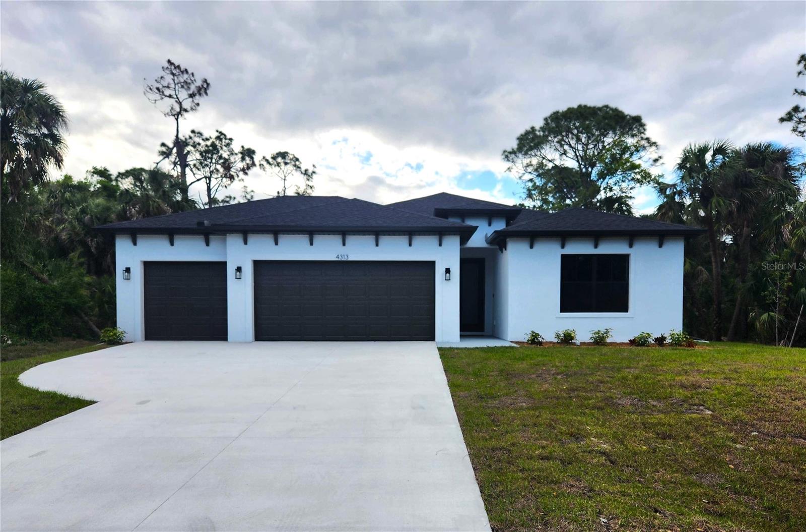 ***3D Virtual Tour Available*** Welcome to your dream home! This stunning brand-new construction in North Port, Florida, is fully completed and move-in ready, offering modern elegance, high-end finishes, and exceptional craftsmanship in a peaceful yet thriving community.
This spacious four-bedroom, three-bathroom home with a three-car garage features an open floor plan with soaring ceilings and an abundance of natural light. Luxury vinyl plank flooring flows throughout, providing a stylish and durable foundation. The gourmet kitchen is designed for both function and beauty, featuring quartz countertops, stainless steel appliances, a large center island, soft-close cabinetry, and a walk-in pantry.
The primary suite is a true retreat, offering his-and-hers walk-in closets and a spa-like ensuite with dual vanities and a glass-enclosed walk-in shower. A second bedroom also includes a private ensuite, making it perfect for guests or multigenerational living. The remaining two bedrooms offer flexibility for family, a home office, or hobby space.
Sliding glass doors lead to a covered and screened-in lanai, an ideal space to unwind and enjoy Florida’s year-round sunshine. The backyard provides privacy and ample room for outdoor activities or future enhancements. For added peace of mind, this home comes with a seven-year structural warranty, a one-year workmanship warranty, and a one-year distribution systems warranty.
North Port is one of Florida’s fastest-growing cities, offering a perfect balance of natural beauty, outdoor recreation, and modern amenities. This home is just a short drive from world-famous Gulf Coast beaches such as Siesta Key, Venice Beach, and Manasota Key. Outdoor enthusiasts will love the miles of scenic trails, parks, golf courses, and waterways for boating, fishing, and kayaking. The city is also home to top-rated schools, shopping centers, dining, entertainment, and cultural experiences. With easy access to I-75, commuting to Sarasota, Fort Myers, and beyond is a breeze.
With North Port’s rapid growth and rising home values, this is an excellent opportunity for homeowners and investors alike. Work with our preferred lender for low wholesale rates, reduced cash-to-close, and potential first-time buyer grants—plus up to $1,500.00 in lender credits for rate buydowns. Don’t miss out on this incredible home—schedule your private showing today!