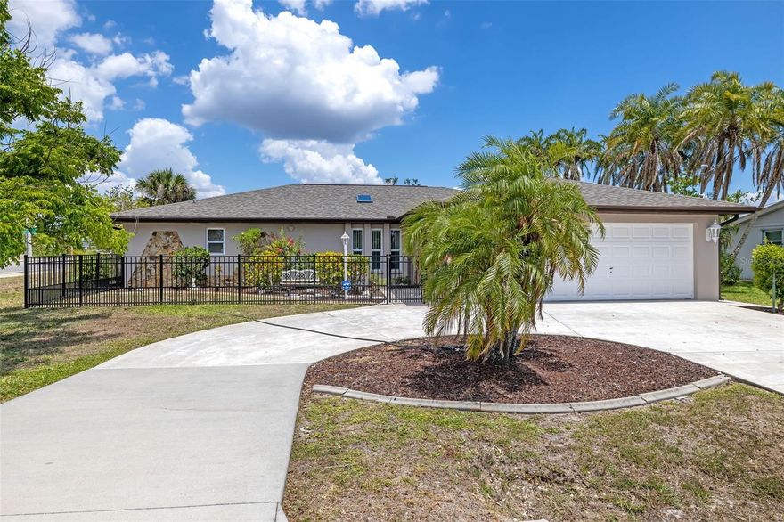 THIS WATERFRONT POOL HOME IS A MUST-SEE IN PORT CHARLOTTE!  This charming waterfront pool home offers the perfect blend of comfort, style, and outdoor living. With over 2,120 sq. ft., this split floor plan features 3 bedrooms, 2 bathrooms, and a bonus room that could easily be converted into an additional bedroom if needed.

Upon entering, you’ll find the home bright and airy. Numerous windows and a skylight enhance the beautiful parquet wood flooring, creating a warm and welcoming ambiance. The spacious living area flows seamlessly into the kitchen, which features granite countertops, newer state-of-the-art stainless steel appliances, an ice maker, and a water cooler. A convenient pass-through window to the pool and patio area makes entertaining friends and family effortless.

Three separate sliding glass doors provide easy access to the pool area. The screened enclosure and vinyl fencing add extra privacy. The generously sized 14’ x 28’ swimming pool includes a newer screen enclosure, pool heater, timer, and pool pump, all replaced in 2022.

Just outside the pool area is your private dock on the Niagara Waterway freshwater canal—perfect for fishing enthusiasts or simply lounging by the peaceful water.

The primary suite offers a spacious retreat with a large walk-in closet and a bonus room (currently used as a music studio) that could serve as an office, library, or den. The two guest bedrooms are located on the opposite side of the home, ensuring privacy for family and visitors, with convenient access to the second full bathroom.

Additional updates include a new shingle roof in 2022 and fresh interior and exterior paint, providing peace of mind for years to come. The circular driveway adds convenience, and the oversized 2-car garage includes steel overhead storage racks and two separate workshop areas.

This home is centrally located in Port Charlotte with easy access to I-75, hospitals, restaurants, shopping, and recreational amenities. Just 6 miles to Downtown Punta Gorda and Downtown Port Charlotte, and only 20 miles to Englewood Beach!

This exceptional home offers the perfect combination of tranquility and convenience. Make it your dream home with your own personal updates. Don’t miss your chance to experience the best of Florida living—call today to schedule your private showing!