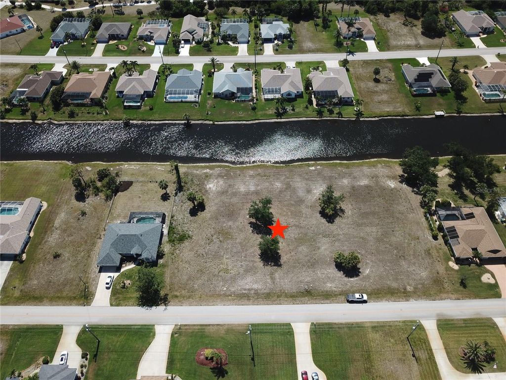 Photo of 826 Boundary Boulevard, Rotonda West, FL 33947 (MLS # C7508592)
