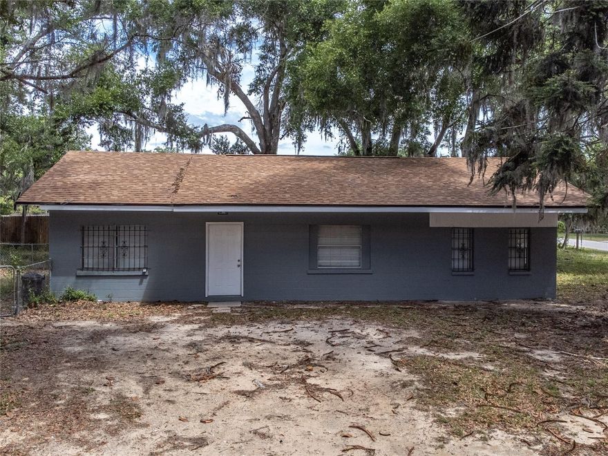 Welcome to 14341 Delmar Street in the heart of Dade City, a charming single-family residence offering comfort, convenience, and opportunity. This 3-bedroom, 1-bathroom home features 1,152 square feet of living space and sits on a desirable corner lot within city limits, providing both privacy and accessibility. Built with durable block construction and a classic ranch-style design, the home offers a functional layout with a spacious living room and dining room combination, ideal for everyday living and entertaining. The kitchen is equipped with essential appliances including a range and refrigerator, while ceiling fans throughout enhance comfort alongside central air and heat. Flooring consists of a mix of carpet and vinyl, offering a practical foundation ready for your personal touch. 

Situated on a fully fenced lot of approximately 0.21 acres, the outdoor space provides room to enjoy, whether for pets, gatherings, or future enhancements. With no HOA and public water and sewer connections already in place, this property offers flexibility for homeowners and investors alike. Located in Flood Zone X, it also provides peace of mind from a flood insurance perspective. 

Beyond the property itself, the location is where this home truly shines. Just minutes away, downtown Dade City offers a charming small-town atmosphere with local favorites like Kafe Kokopelli and Steph's Southern Soul Restaurant, along with boutique shopping and seasonal events that bring the community together. Outdoor enthusiasts will appreciate proximity to Withlacoochee River Park and Dade City's Wild Things, offering unique recreational and wildlife experiences. For everyday conveniences, shopping and dining options are easily accessible along the US-301 and US-98 corridors, while nearby Wesley Chapel provides access to larger retail destinations, entertainment, and medical facilities including AdventHealth Wesley Chapel. Commuters will also appreciate convenient access to Interstate 75, making travel to Tampa and surrounding areas seamless.

Whether you are a first-time homebuyer, investor, or someone looking to enjoy the charm of Dade City living, this property presents a fantastic opportunity to own a home in a growing area with character, convenience, and potential.