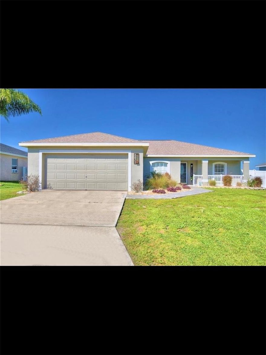 Welcome to your dream home at a REDUCED PRICE!!! This stunning 3-bedroom, 2-bathroom, 2-car garage residence boasts modern interiors and vaulted ceilings, creating an inviting atmosphere flooded with natural light. Step outside to your fenced backyard oasis, complete with a stone path leading to a cozy firepit, perfect for gatherings with friends and family. Say goodbye to carpet and revel in the Luxury Vinyl Plank throughout the entire home, offering easy maintenance and a contemporary aesthetic. The primary bedroom is a true retreat, featuring a fully ensuite bathroom with a separate shower, soaking tub, double vanities,2 walk in closets and a private water closet. The well-appointed guest bedrooms share a spacious guest bathroom, ensuring comfort and convenience for all. Inside, you'll find an inside laundry room for added convenience, while the kitchen is a chef's delight with loads of cabinet and countertop space, stainless steel appliances, and a separate breakfast nook. The family room is spacious and ready for entertaining, while a separate formal dining room provides an elegant setting for special occasions. Roof was replaced late 2021, floors 2021, paint inside and out 2020 .Enjoy the perks of low HOA fees and the convenience of being close to everything you need, from I-4 access to medical facilities, retail centers, and a variety of restaurants. With its prime location just minutes away from Disney and both Tampa and Orlando airports, this home offers the perfect blend of comfort and accessibility. Don't miss out on the opportunity to make this your own slice of paradise—call to schedule a private viewing today!