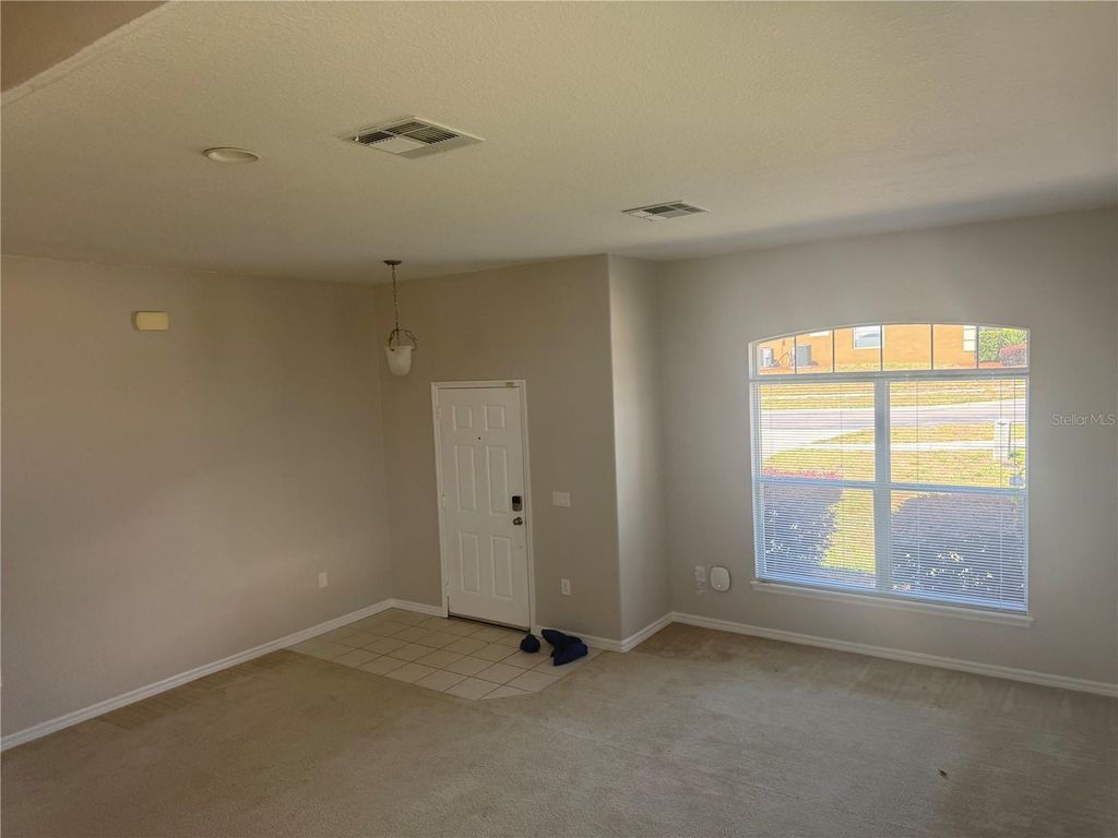 Photo of 722 Cadiz Loop, Davenport, FL 33837 (MLS # O6404578)